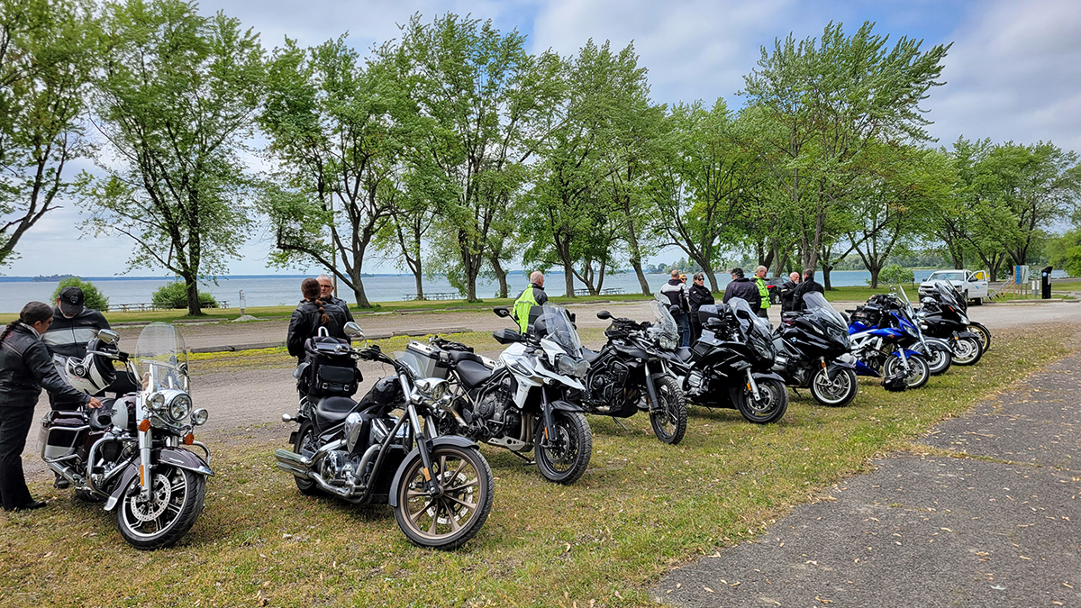 many motorcycles parked on the waterfront