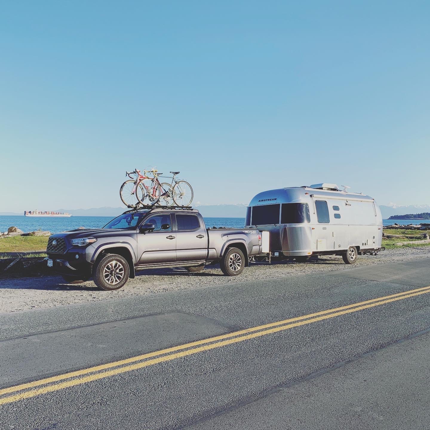 An RV trailer pulled over on the side of the road. 