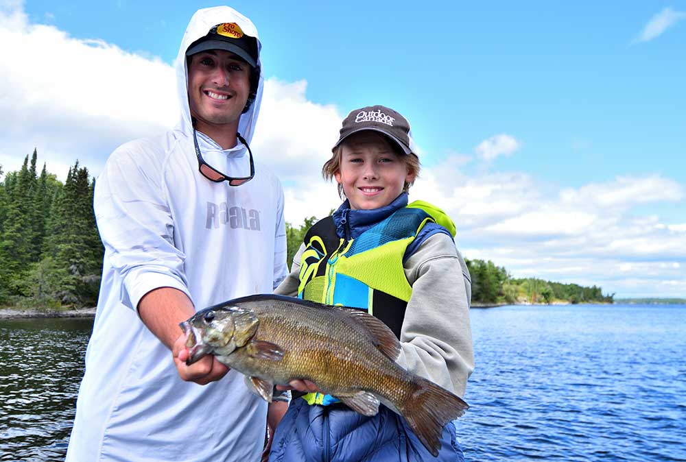 2 young anglers with smalllmouth bass