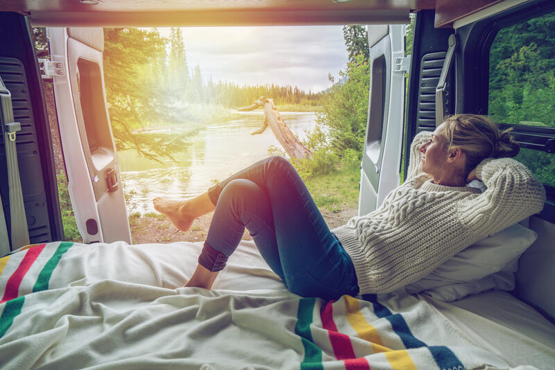 Young woman looking out window