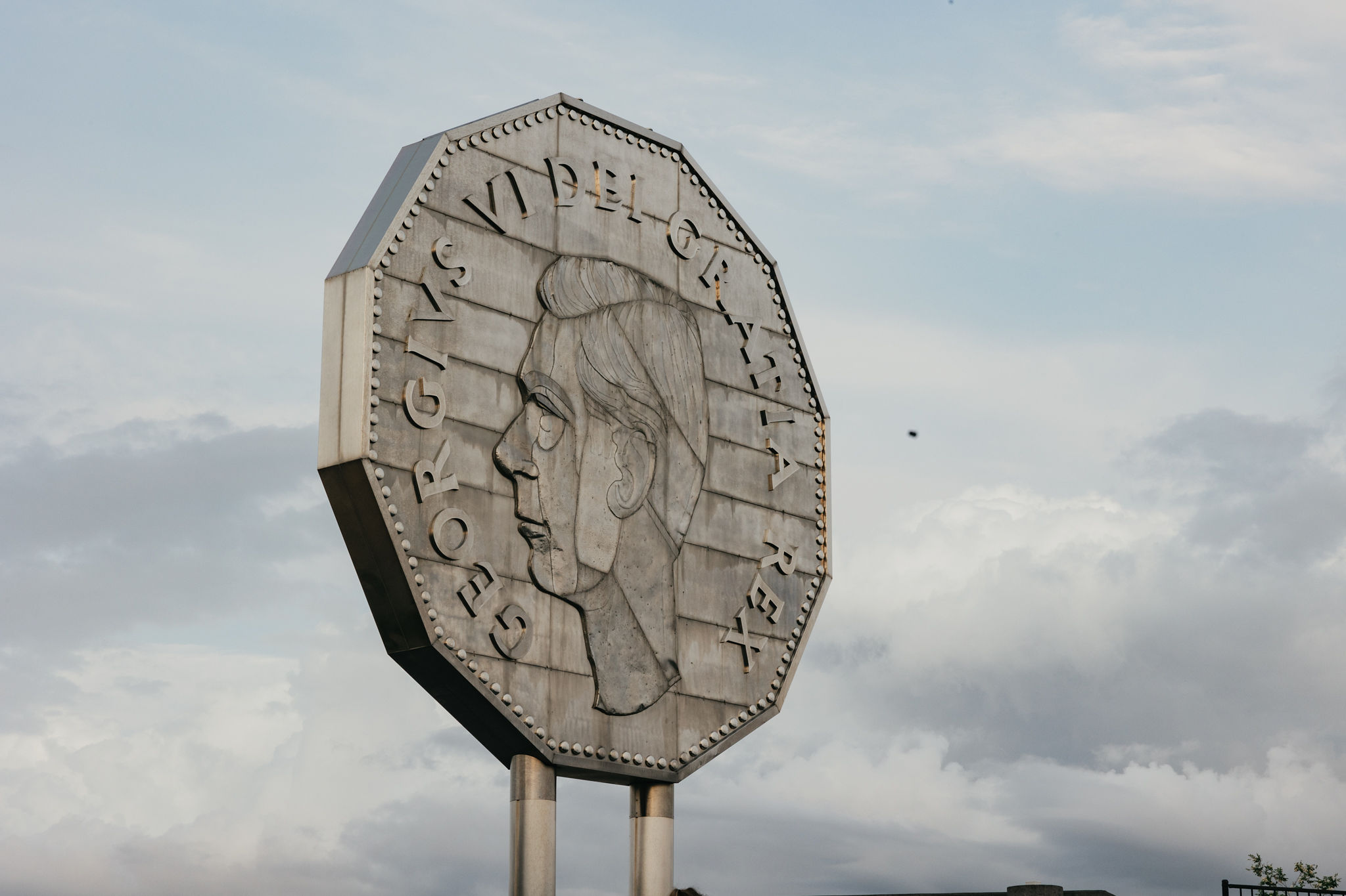 the heads side of Sudbury's Big Nickel Monument, showing the profile of King George VI