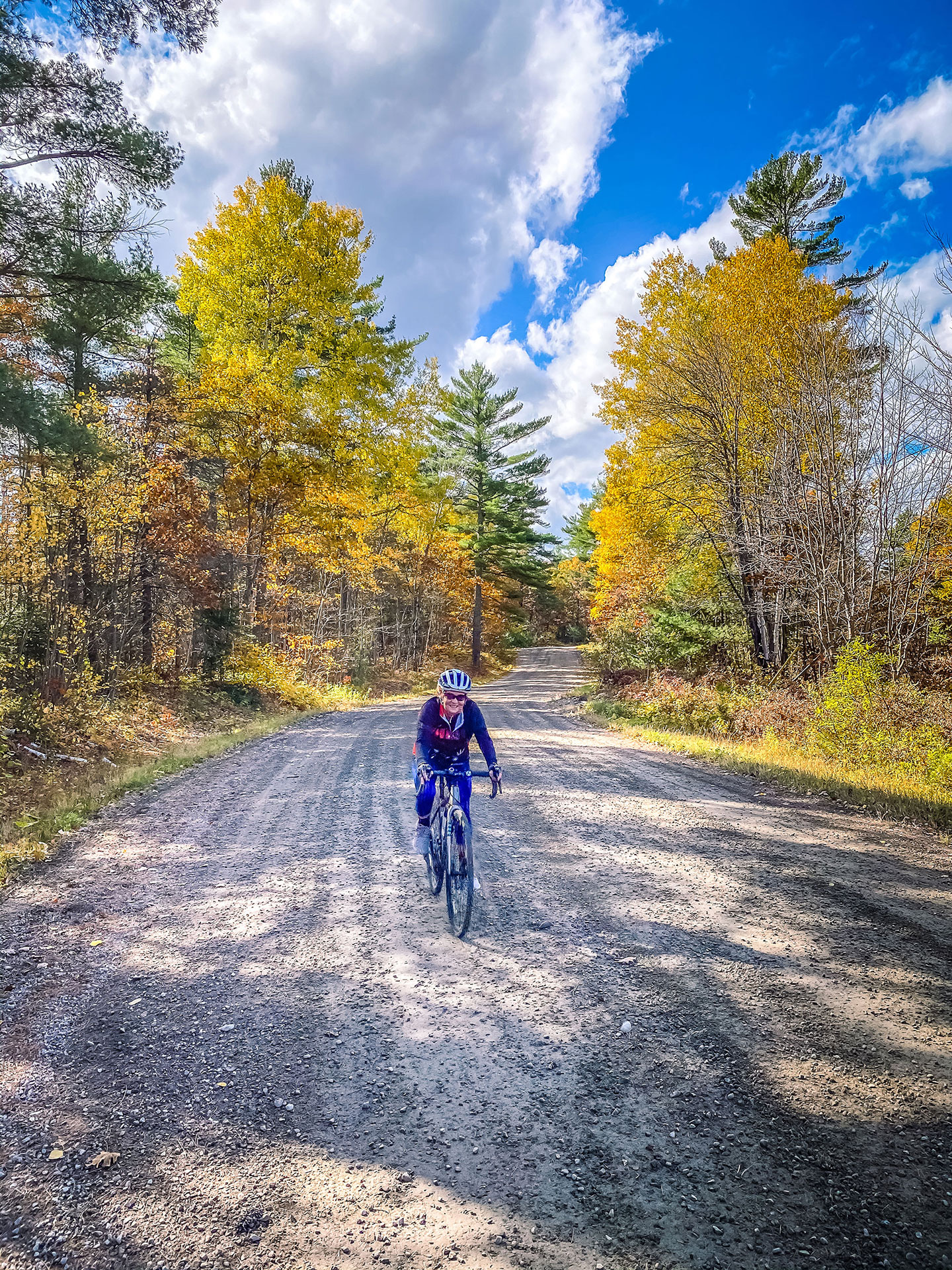 a person cycling down a fall path