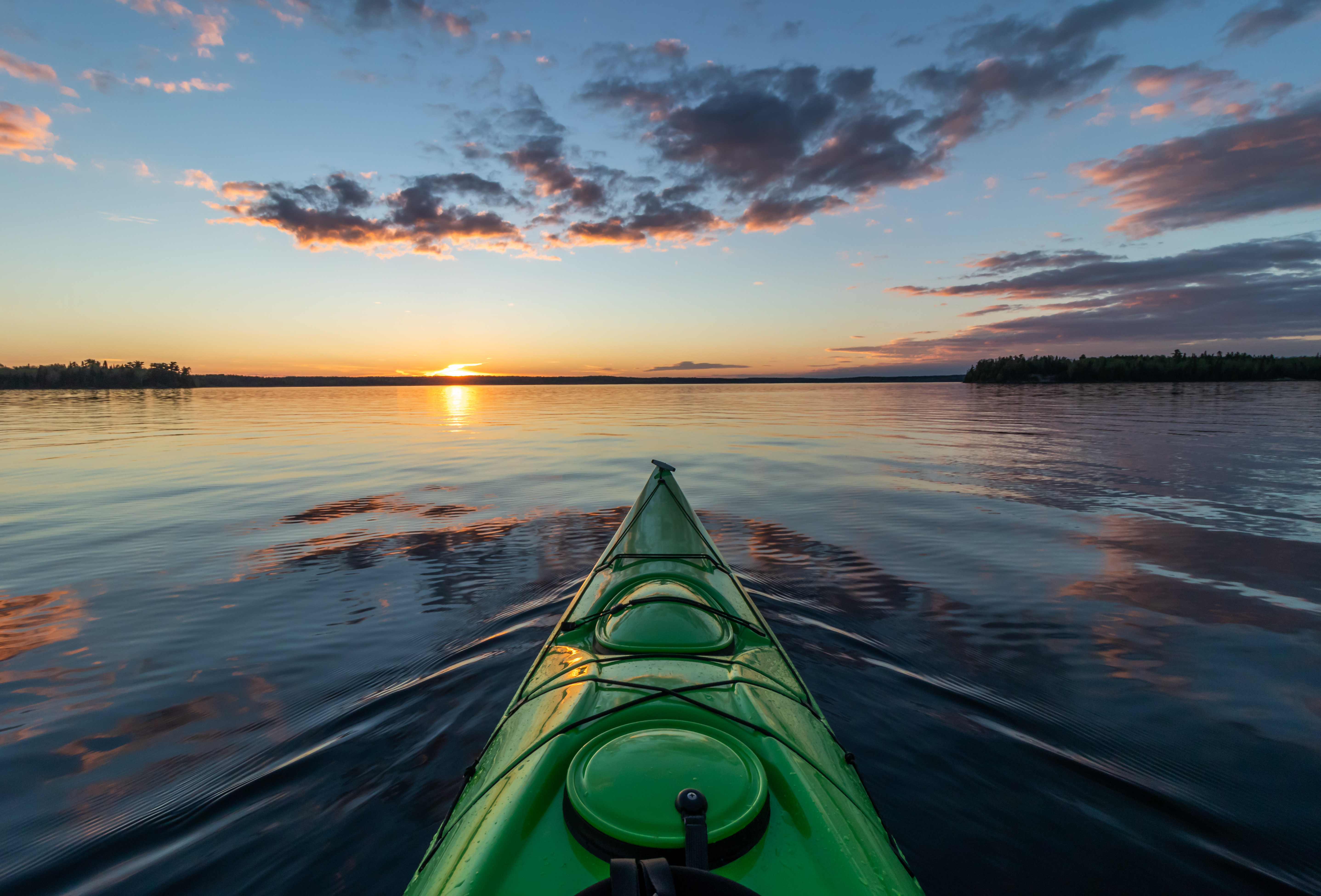 Kayaking on the lake at sunset