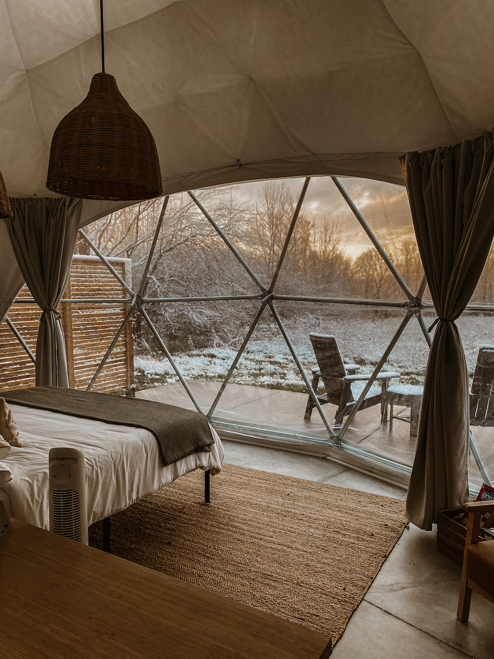 View from inside glamping dome of wintry day.