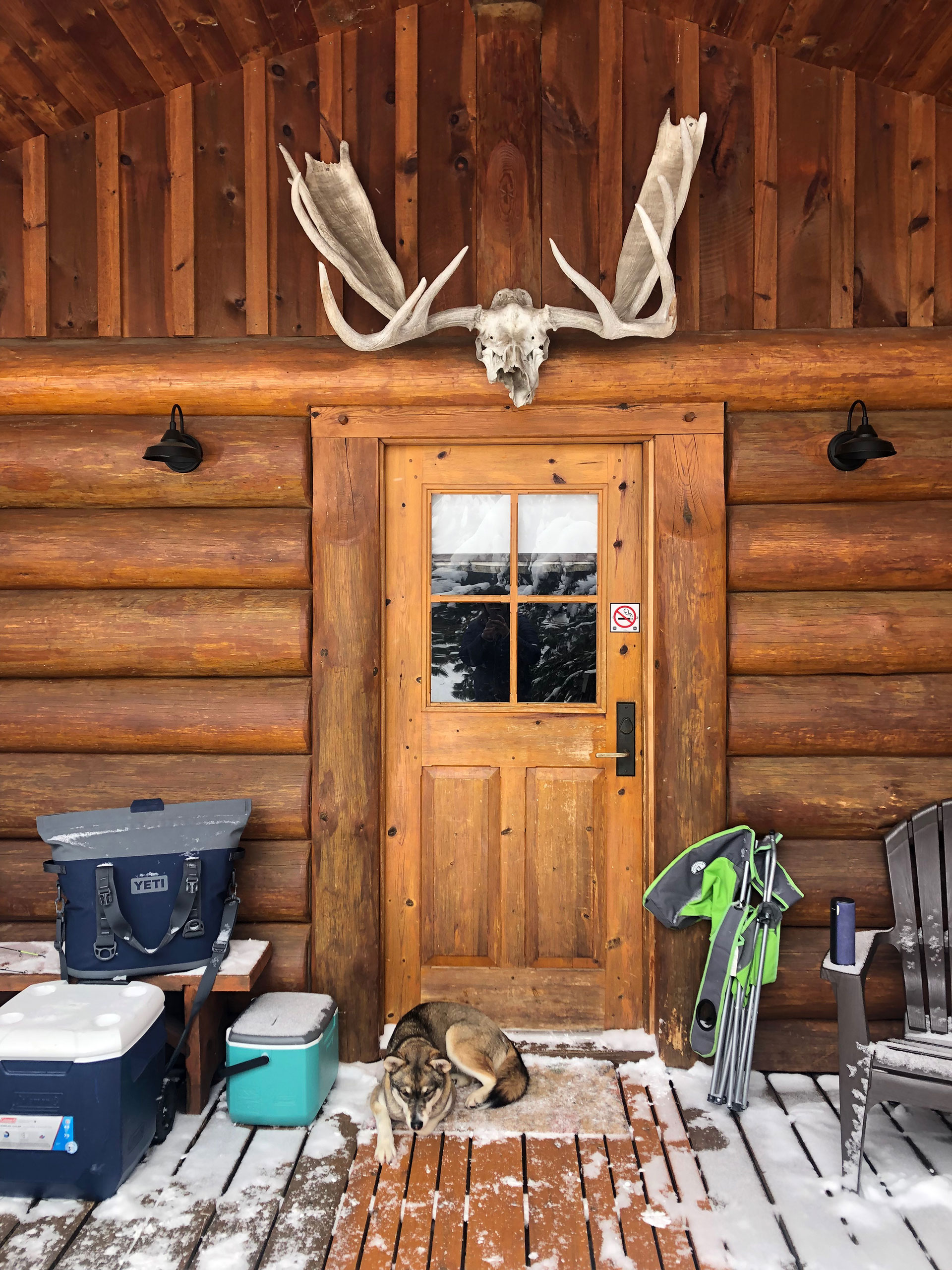 the entrance to a Quetico cabin in winter, with skull and antlers over the door