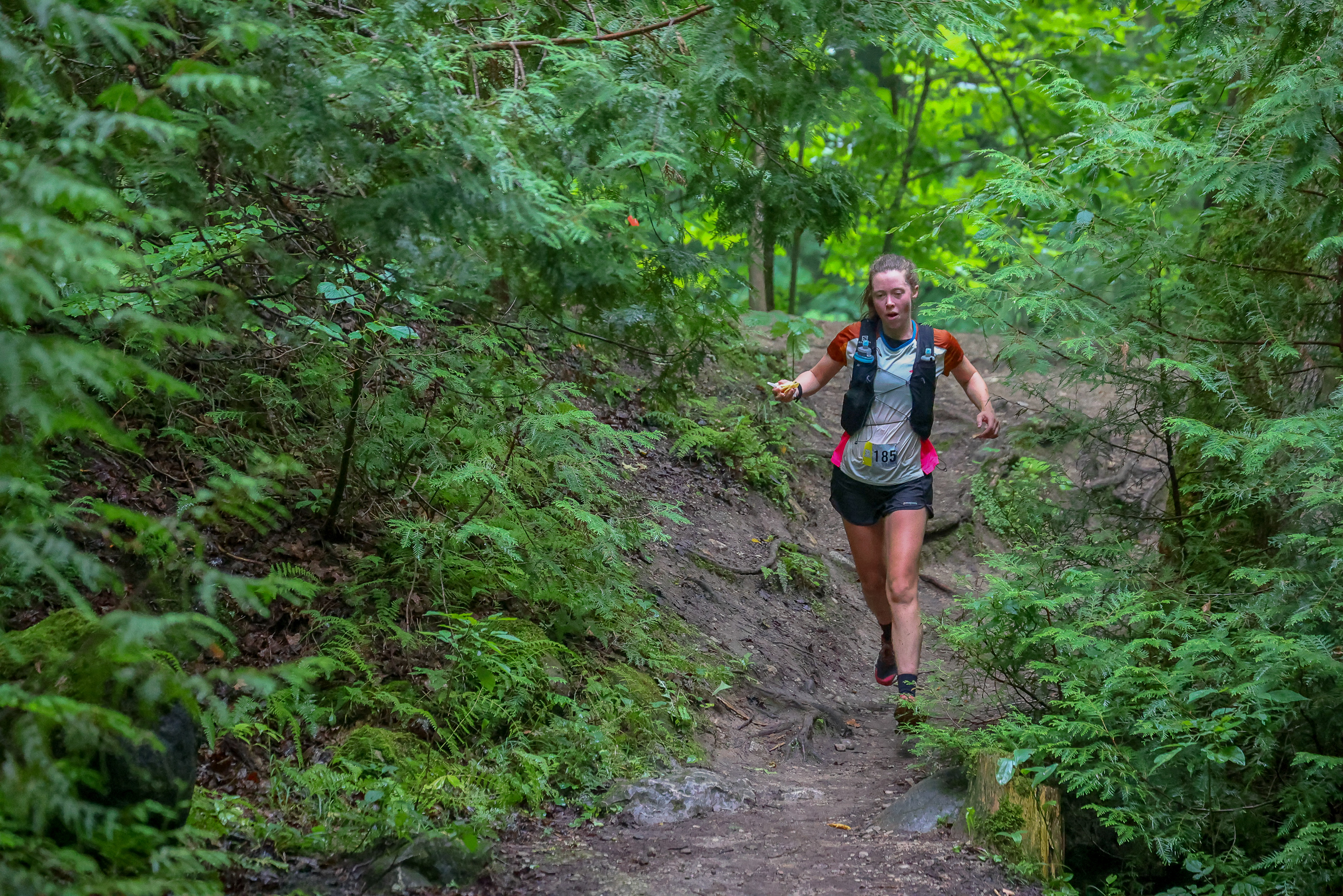 woman trail running during a race