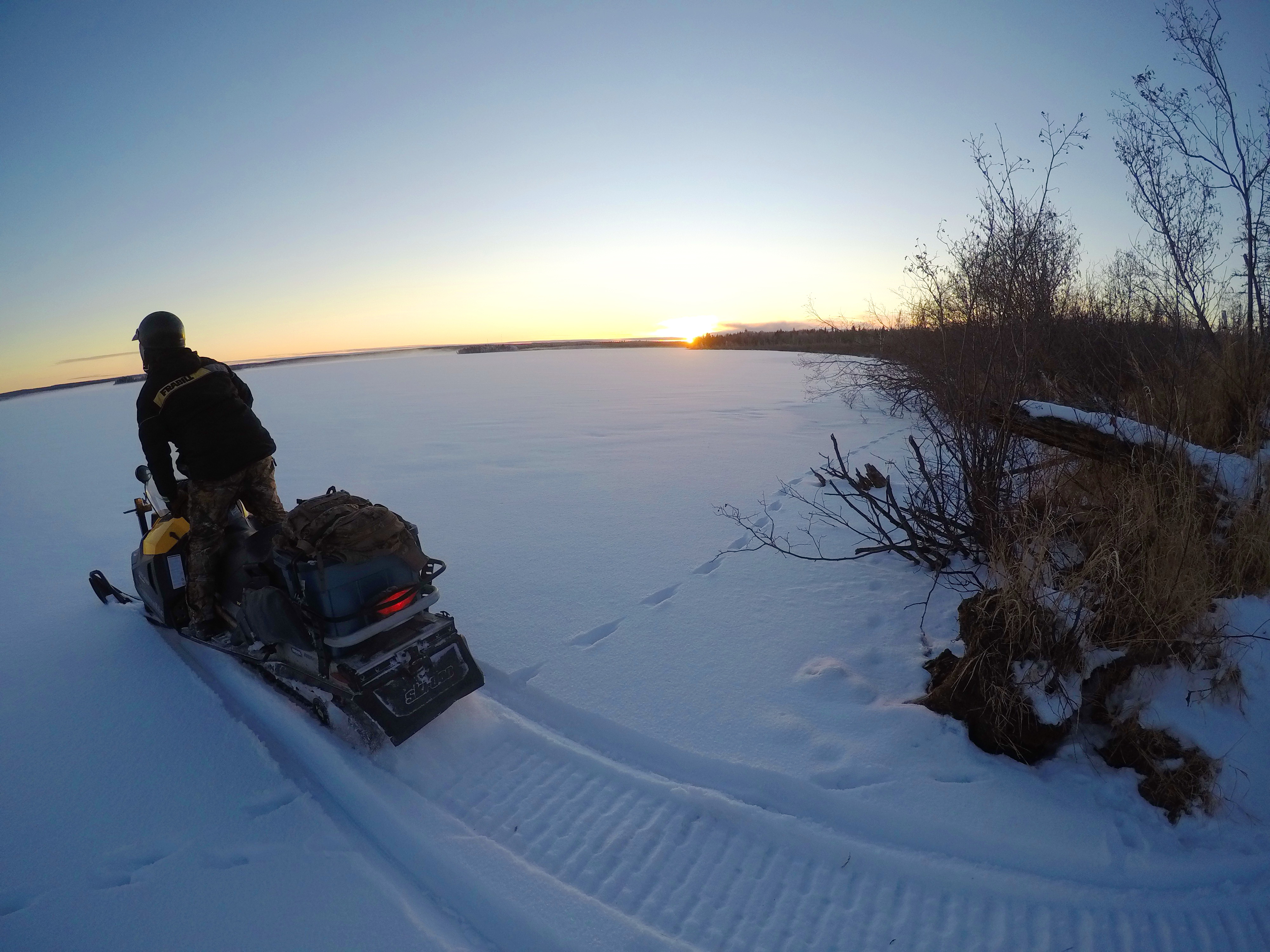 Snowmobiles will get you to the best fishing spots in a heartbeat