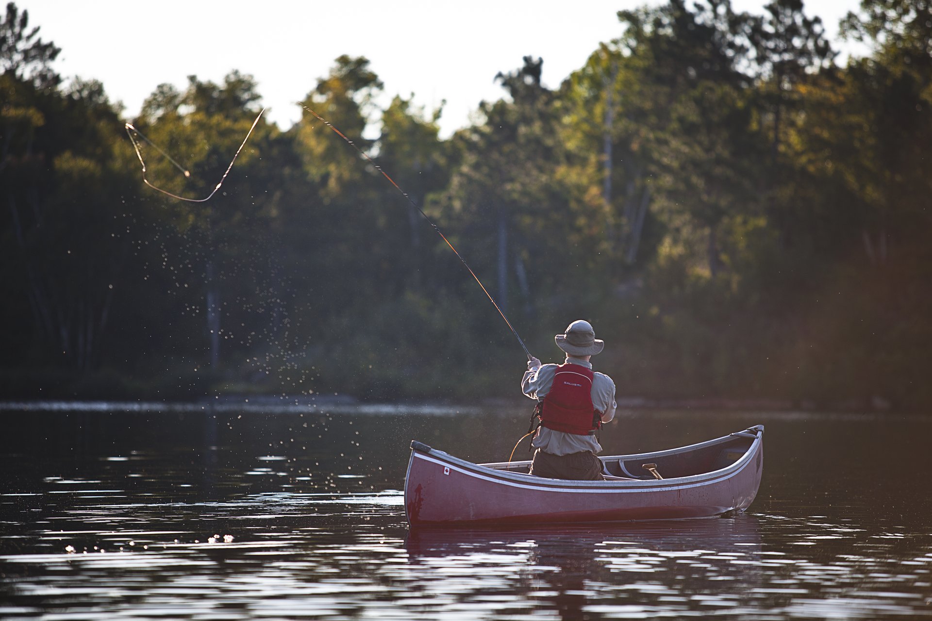 Fly fishing from a canoe near Sudbury, Ontario