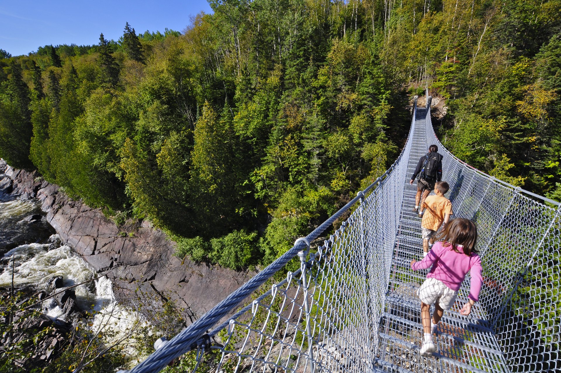 hiking along the White River Suspension Bridge in Pukaskwa National Park