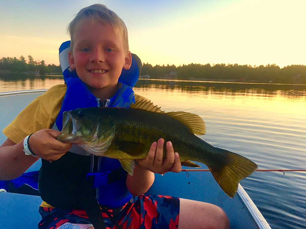 young child fishing smallmouth bass