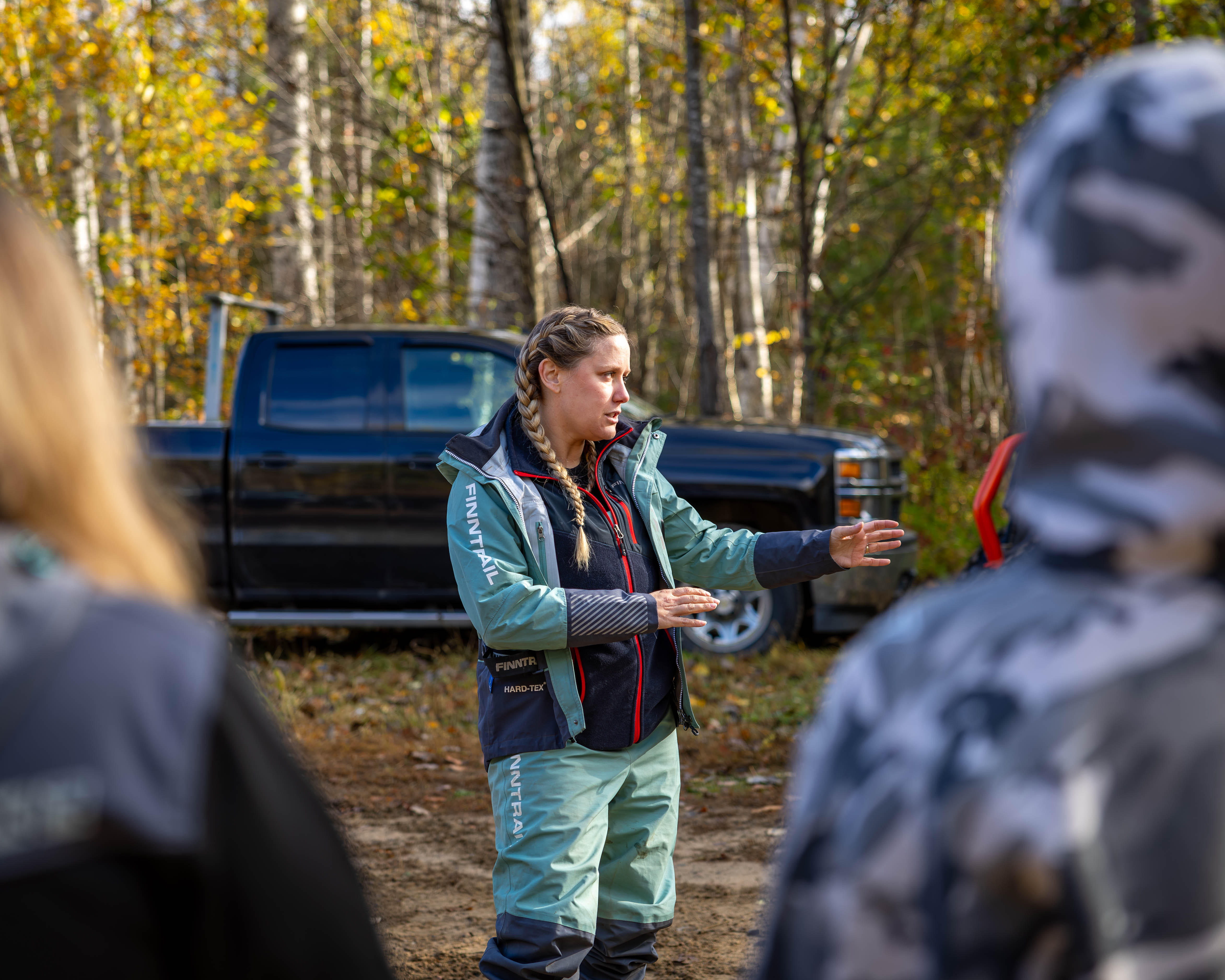 Cassandra Mainville Explains Different Riding Techniques to the Group Before Leaving the Trail Head