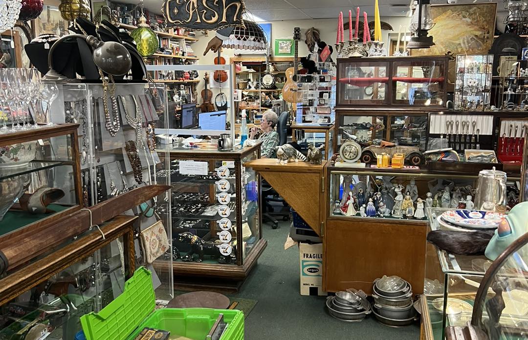 Shelves full of an vast array of small antique items in Black Cat Antiques