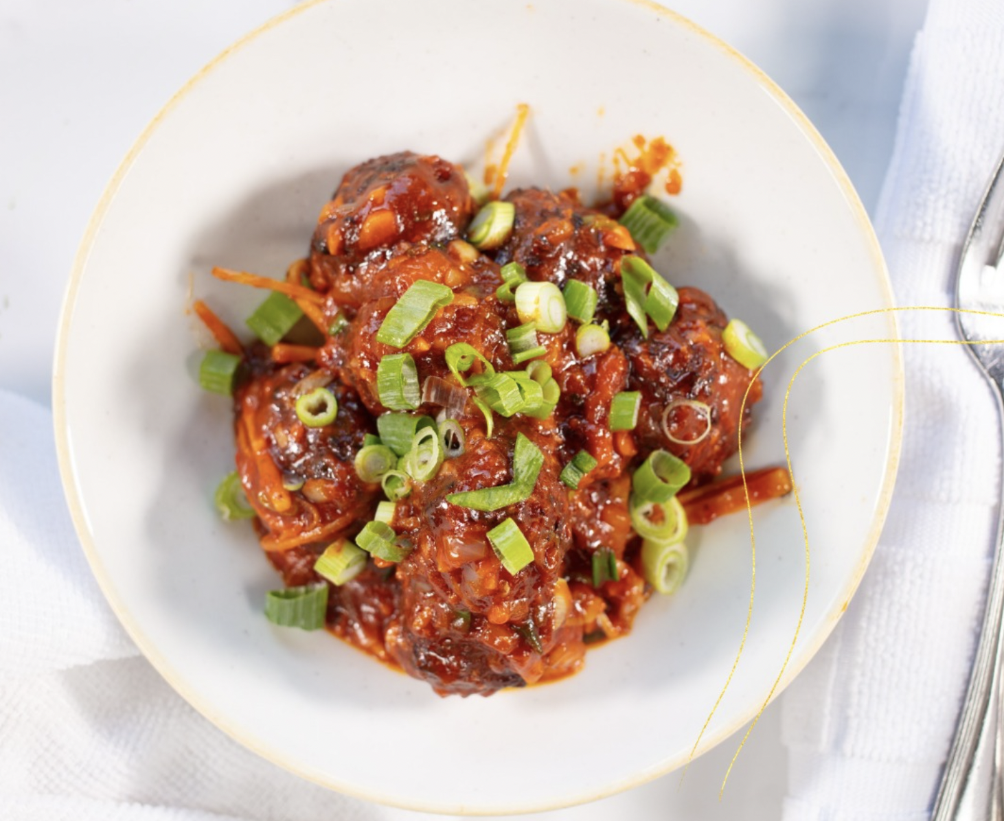 Marigold vegetable manchurian with vegetable balls in a savory sauce