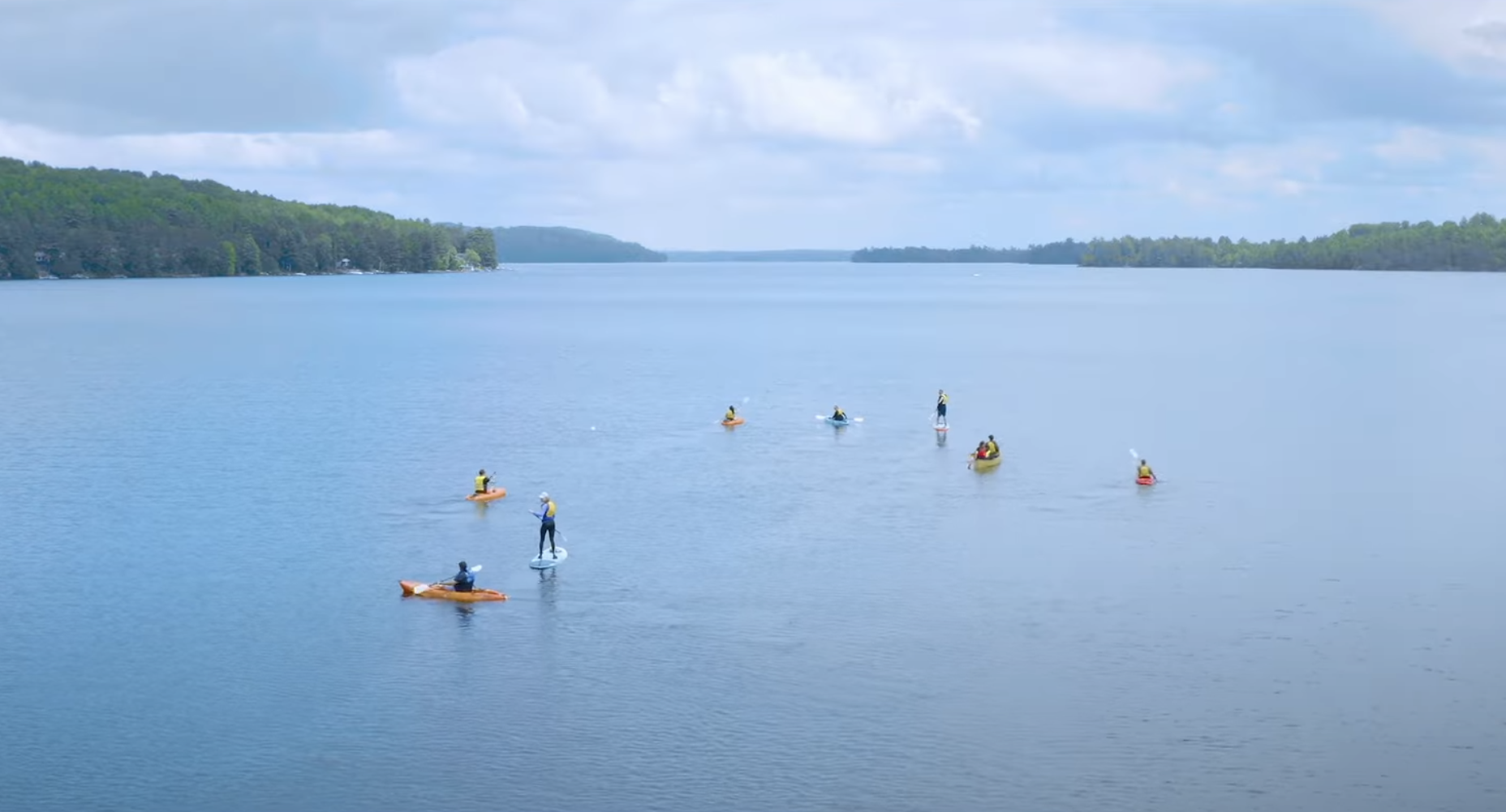 A group of SUP paddlers on a lake in North Bay, Ontario. 