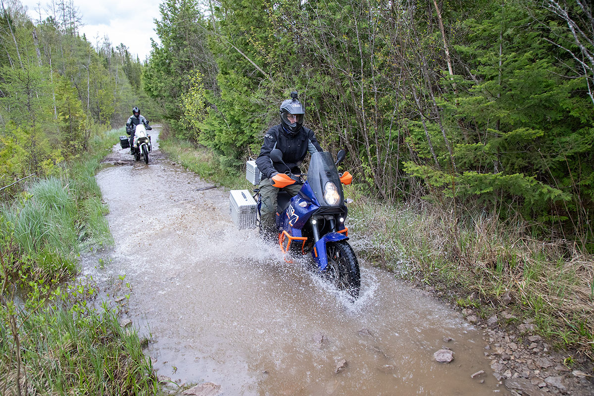 A Motorcycle rider in water.