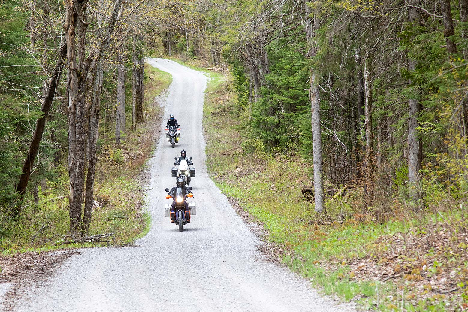 Motorcycle riders on a stretch of highway.