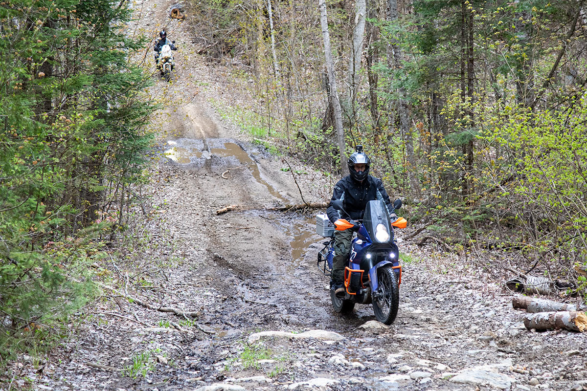 Motorcycle riders on a stretch of highway.