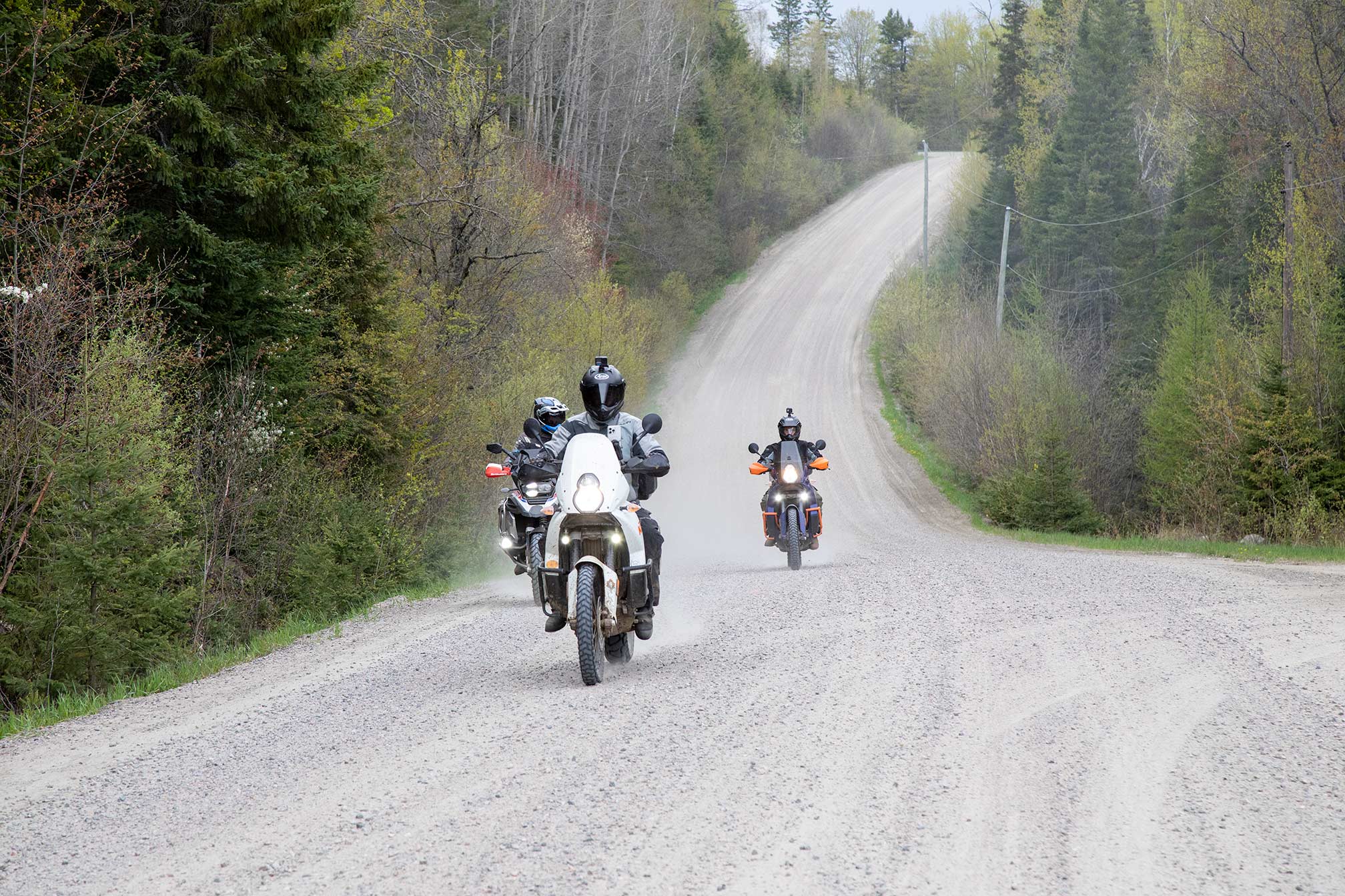 Motorcyle riders on a long stretch of highway