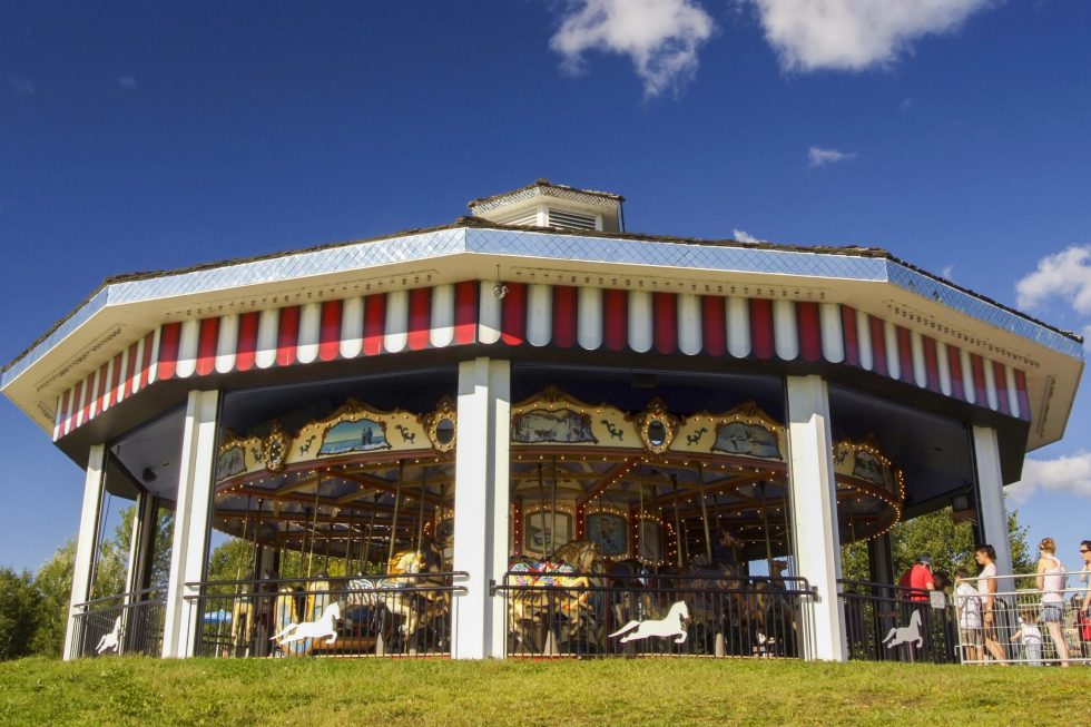 Colourful carousel with a blue sky. 