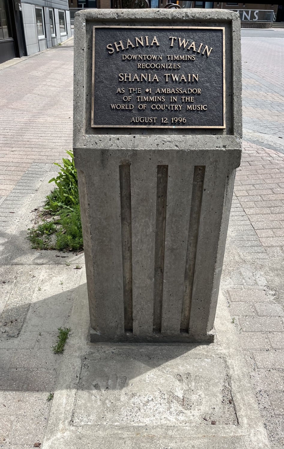 A wide view of the entire Shania Twain Monument which shows the plaque at the top and the imprint of Shania Twain's hands at the bottom