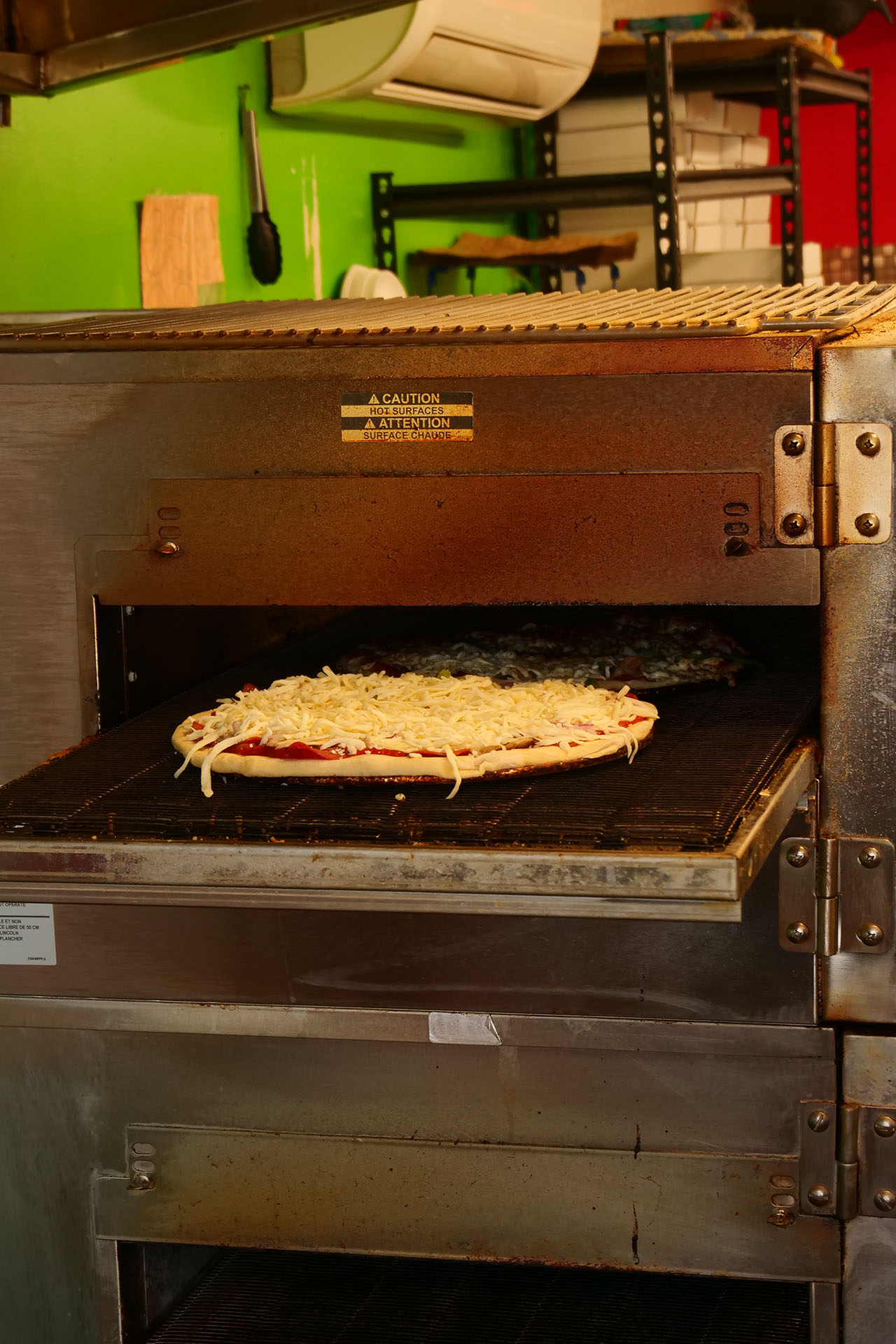 a pizza oven with a fresh pizza ready to go in at Francesco's in Porcupine.