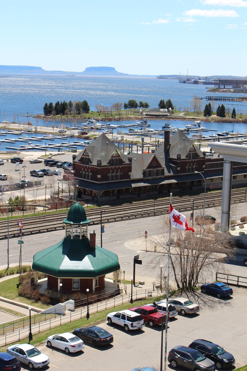 A watefront view with a parking lot in the foreground in Thunder Bay.