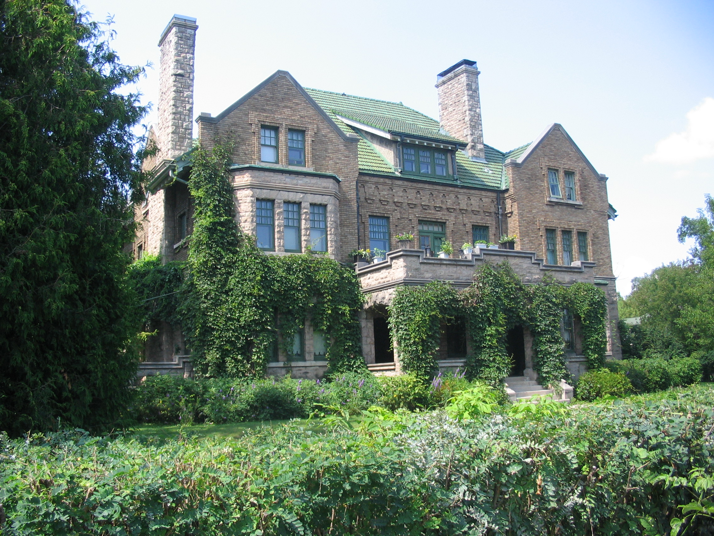 Murphy House in Thunder Bay; a large vine-covered stone house of  English Gothic and Tudor design.