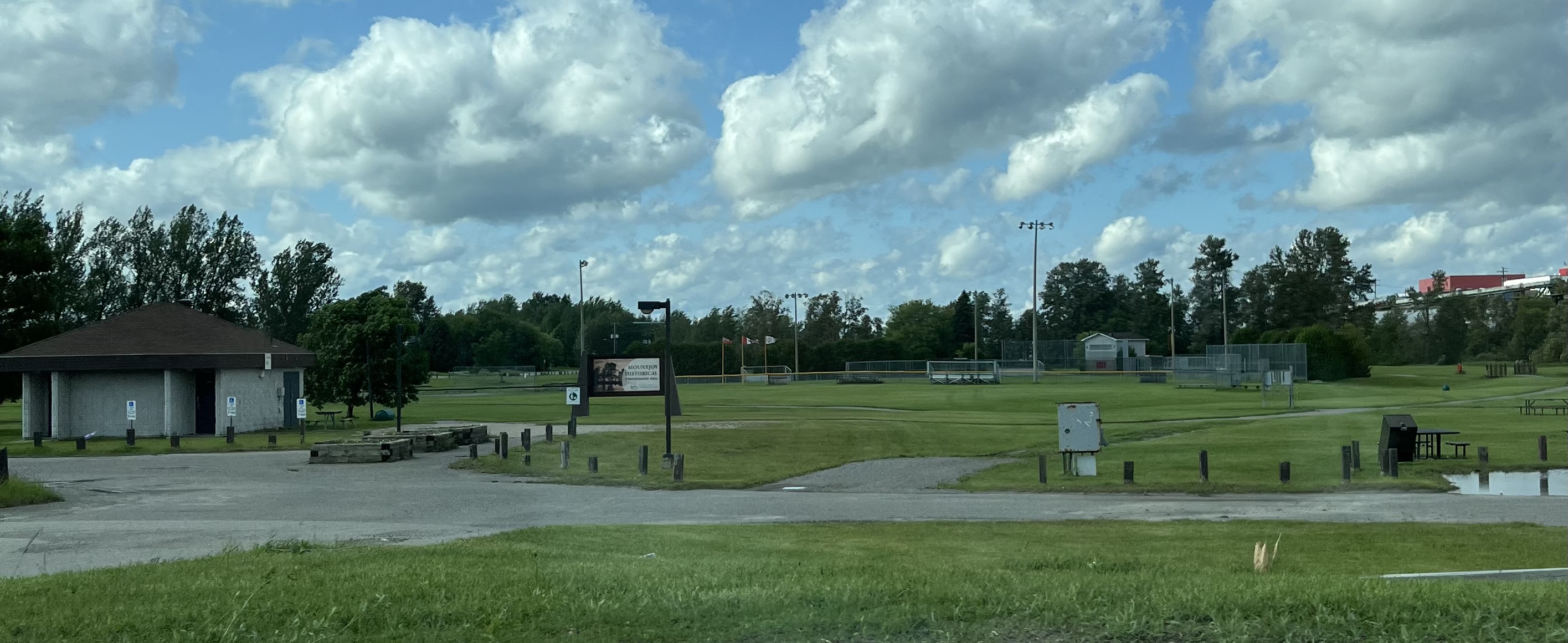 A zoom-out of the Mountjoy Historical Conservation Area which includes the ballpark in the center, the rest rooms and the Mountjoy Historical Conservation Area sign on the left-hand side of the picture.