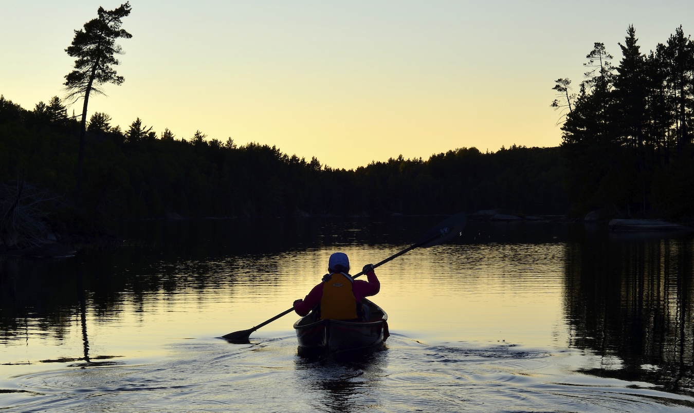 canoeing at sunset