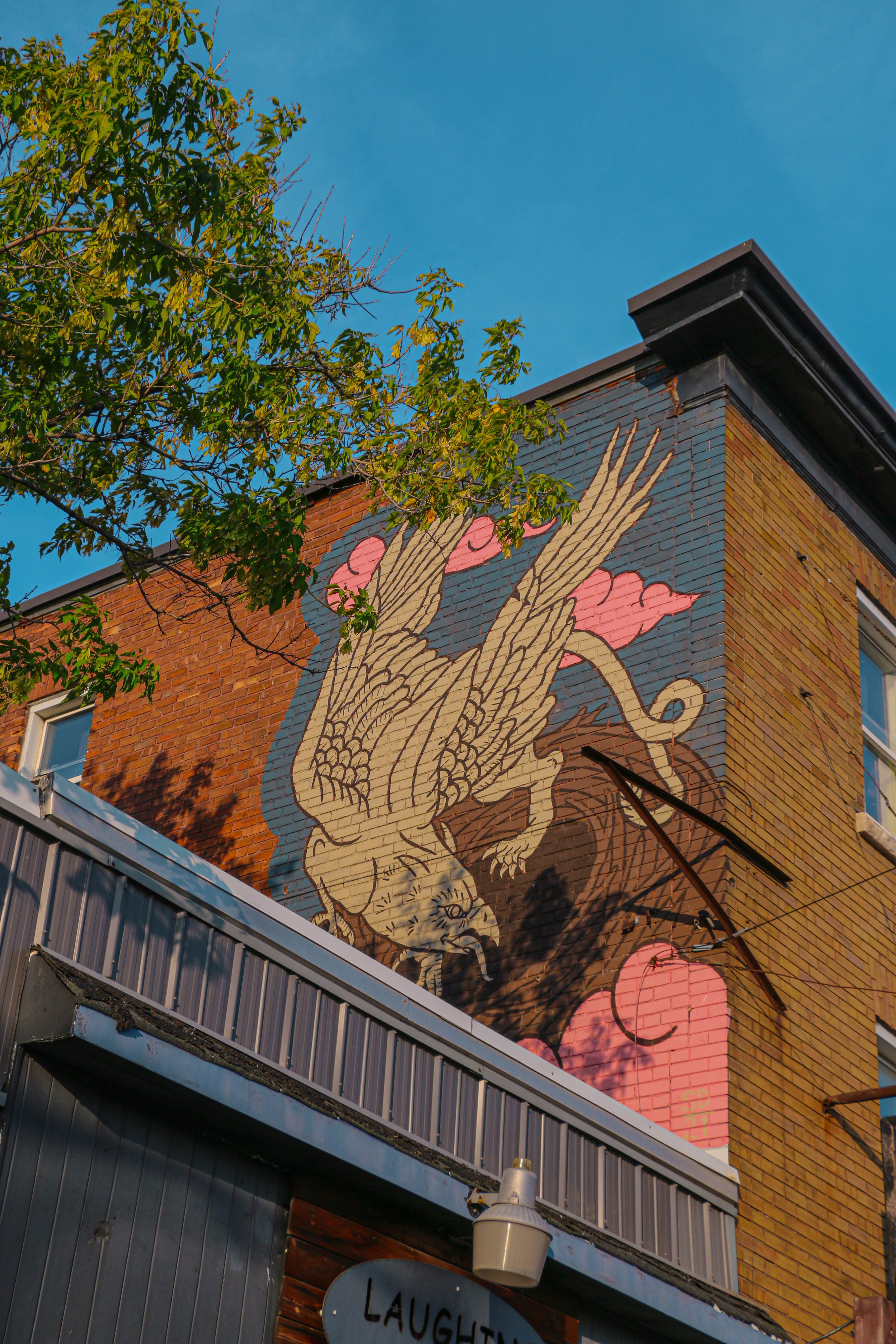 Mural of bird-like creature 