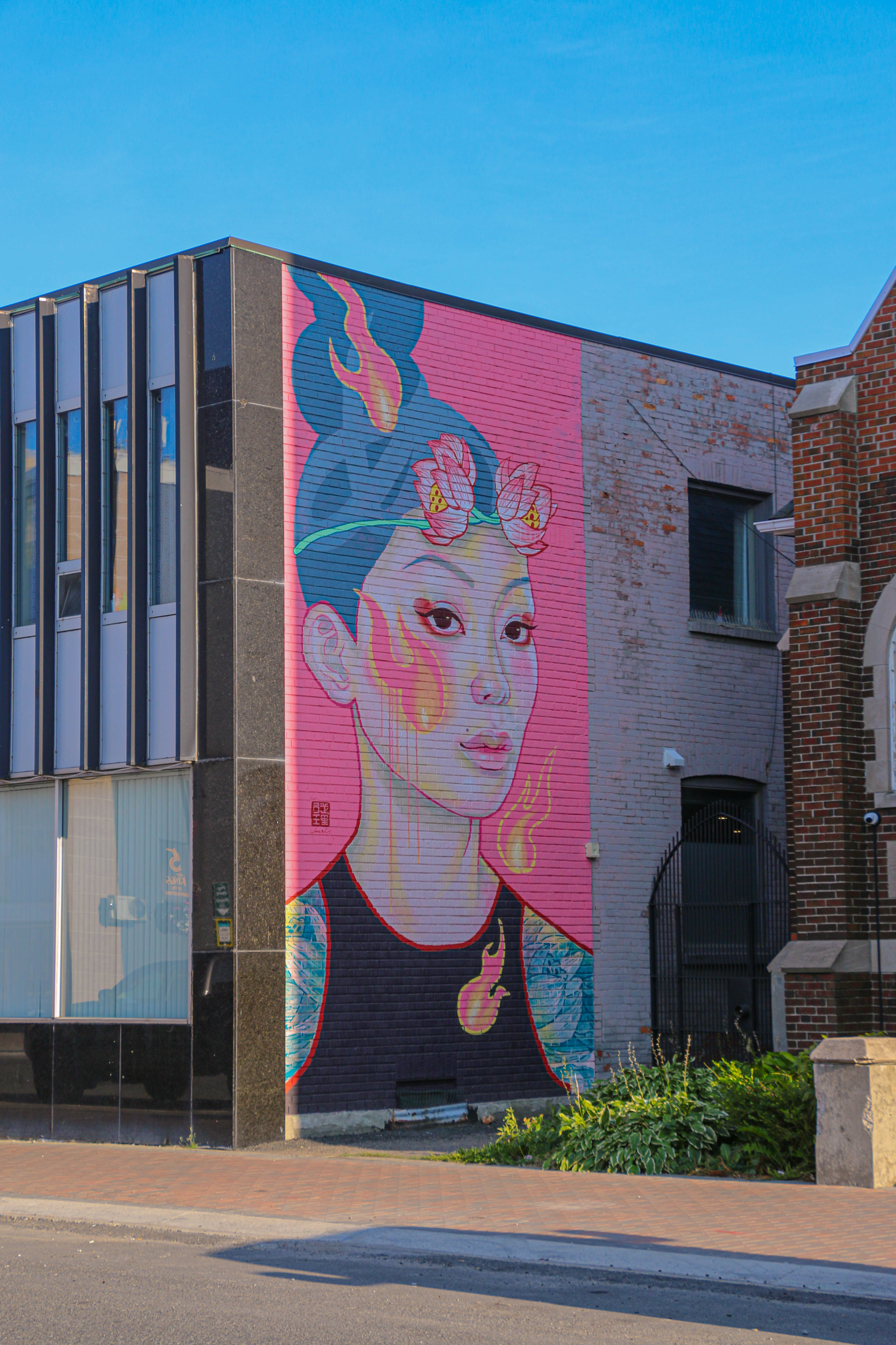 Mural of woman with pink background