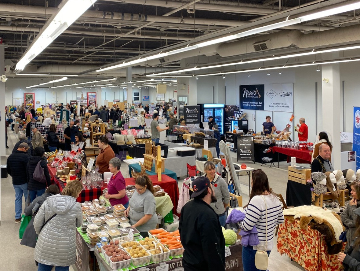 People shopping at local vendors tables at Elm Place