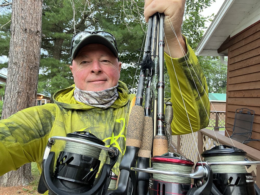 extreme angler tv angler holding fishing rods