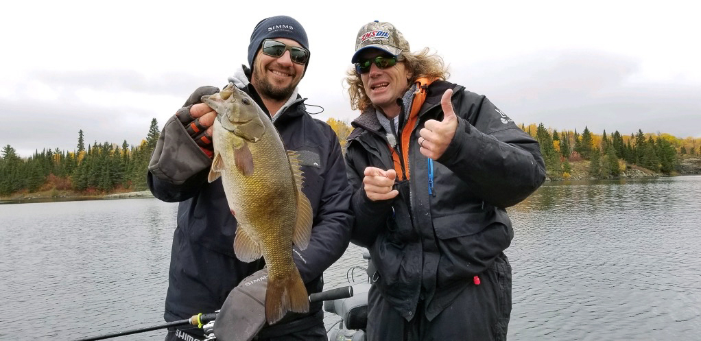 Jeff Gustafson and Pete Maina catching bass while muskie fishing