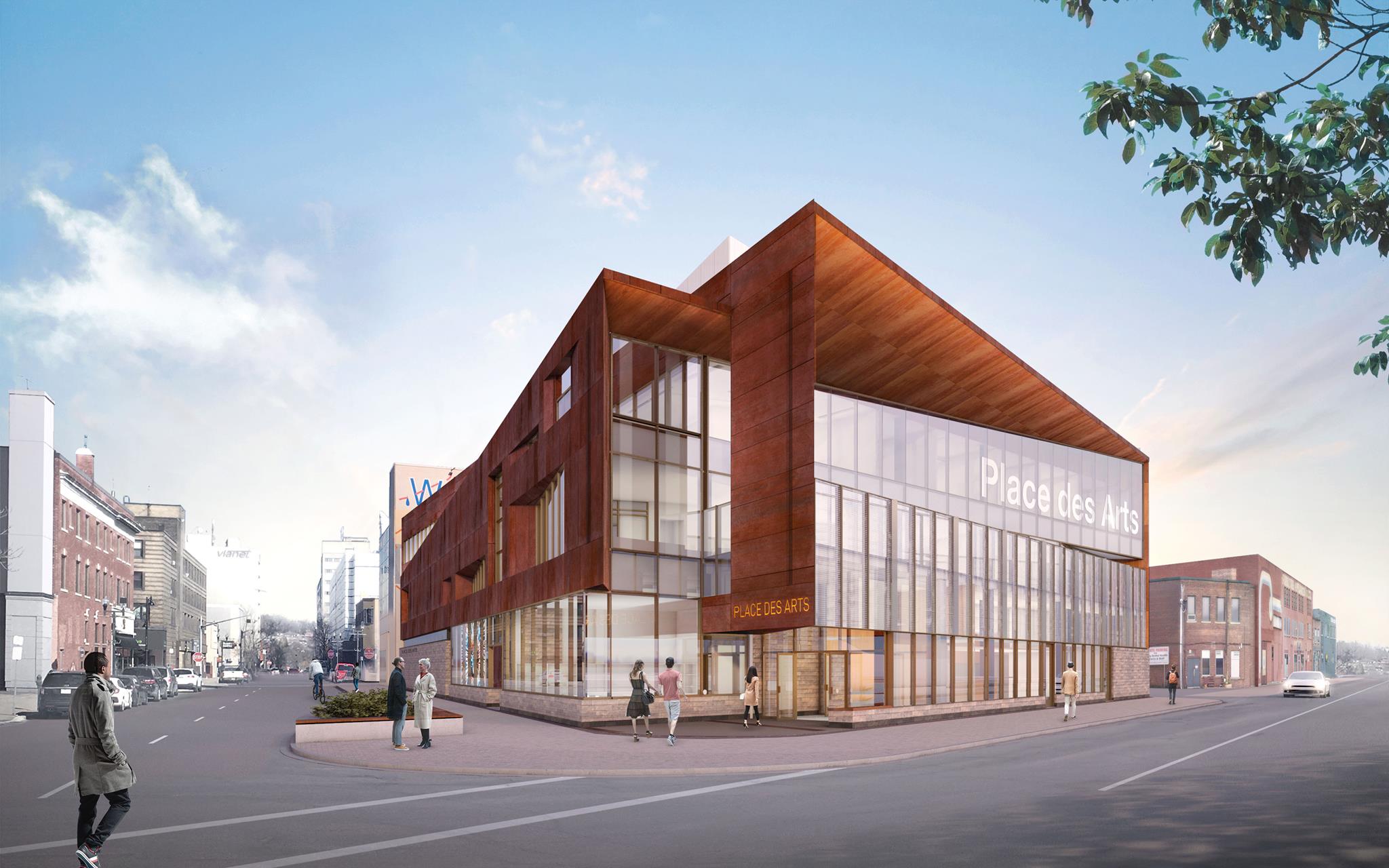 Place des Arts in Sudbury; a large, modern-styled building with shining glass walls in front of a blue sky. Patrons are walking in.