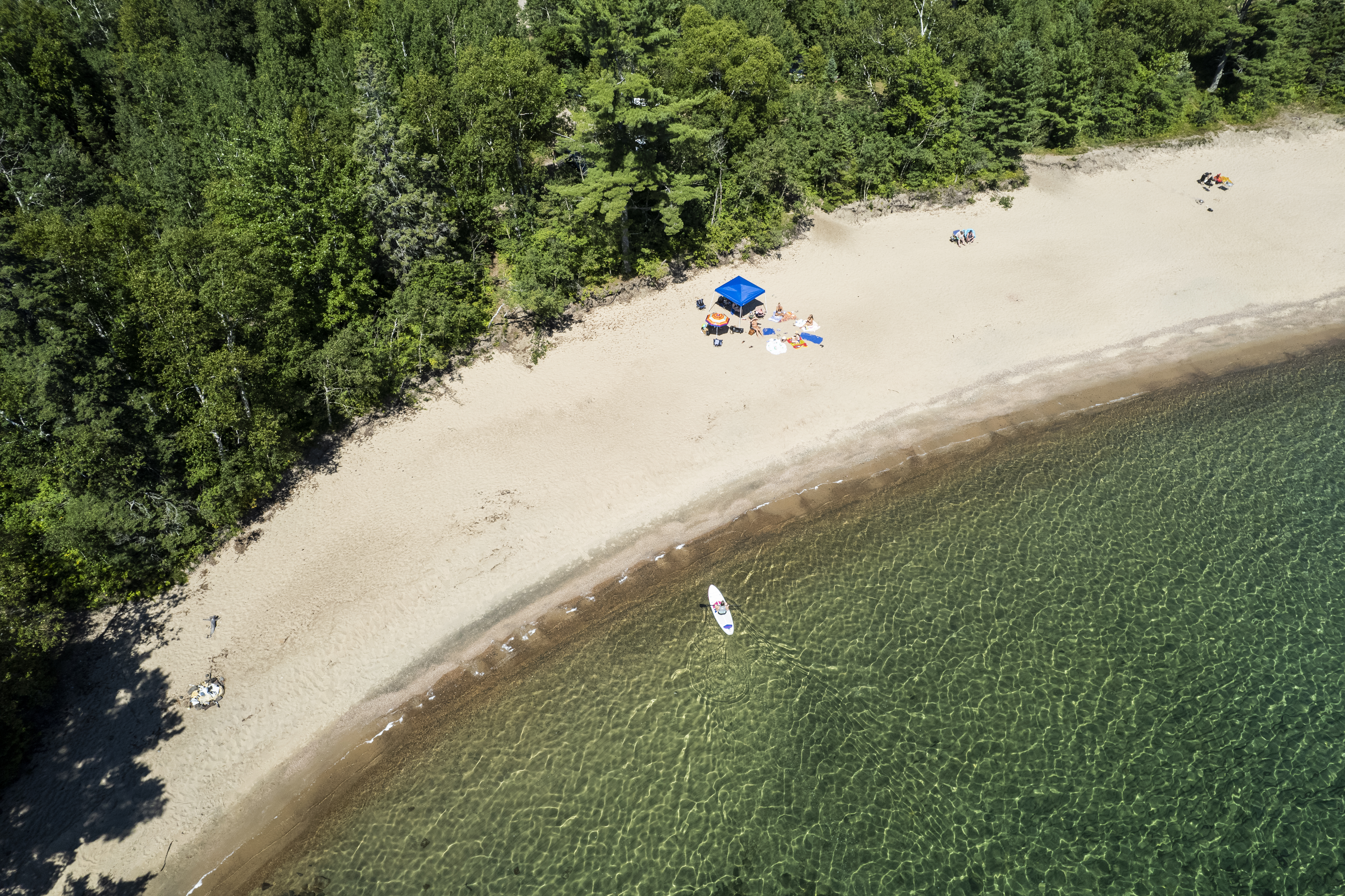 Adventure abounds on the crystal clear waters of Pancake Bay. Credit: Colin Field