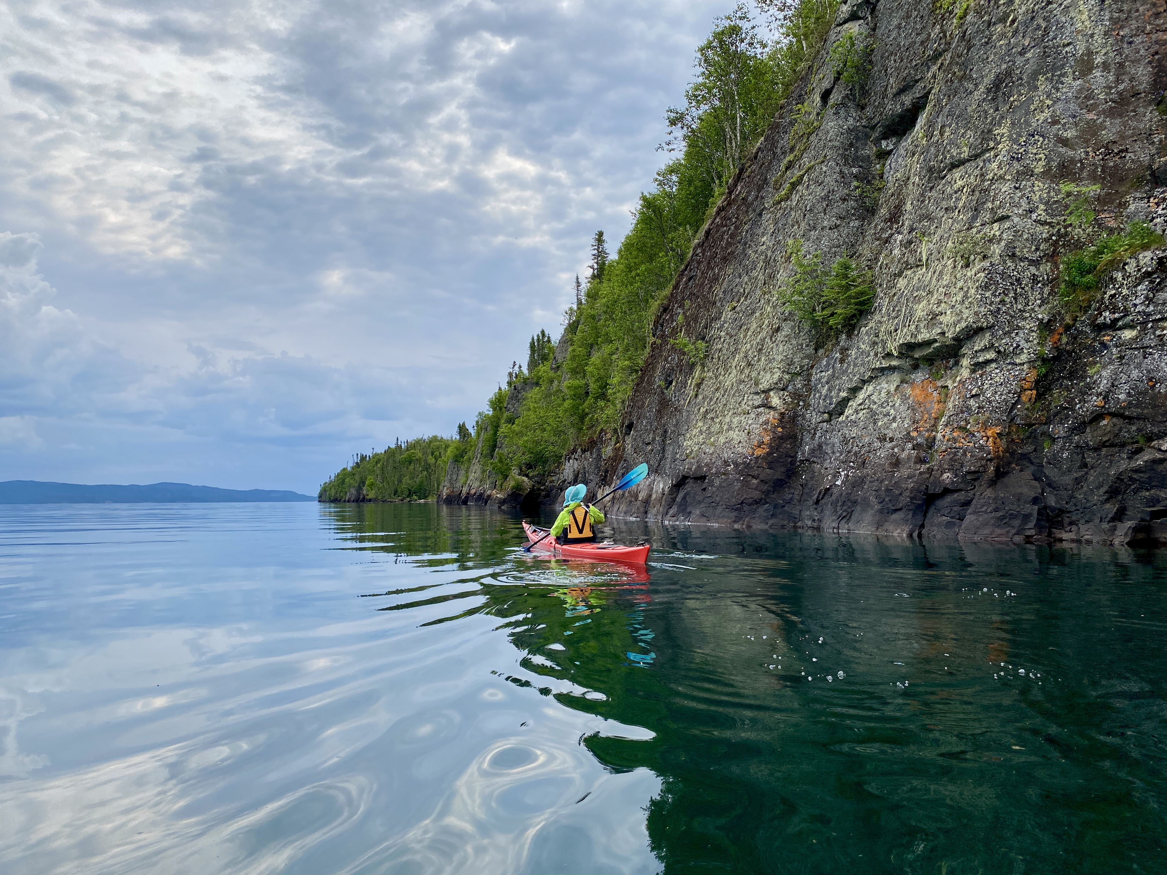 Sea kayaking the black cliffs of haunted Talbot Island.  Credit: Virginia Marshall | @wander.winne