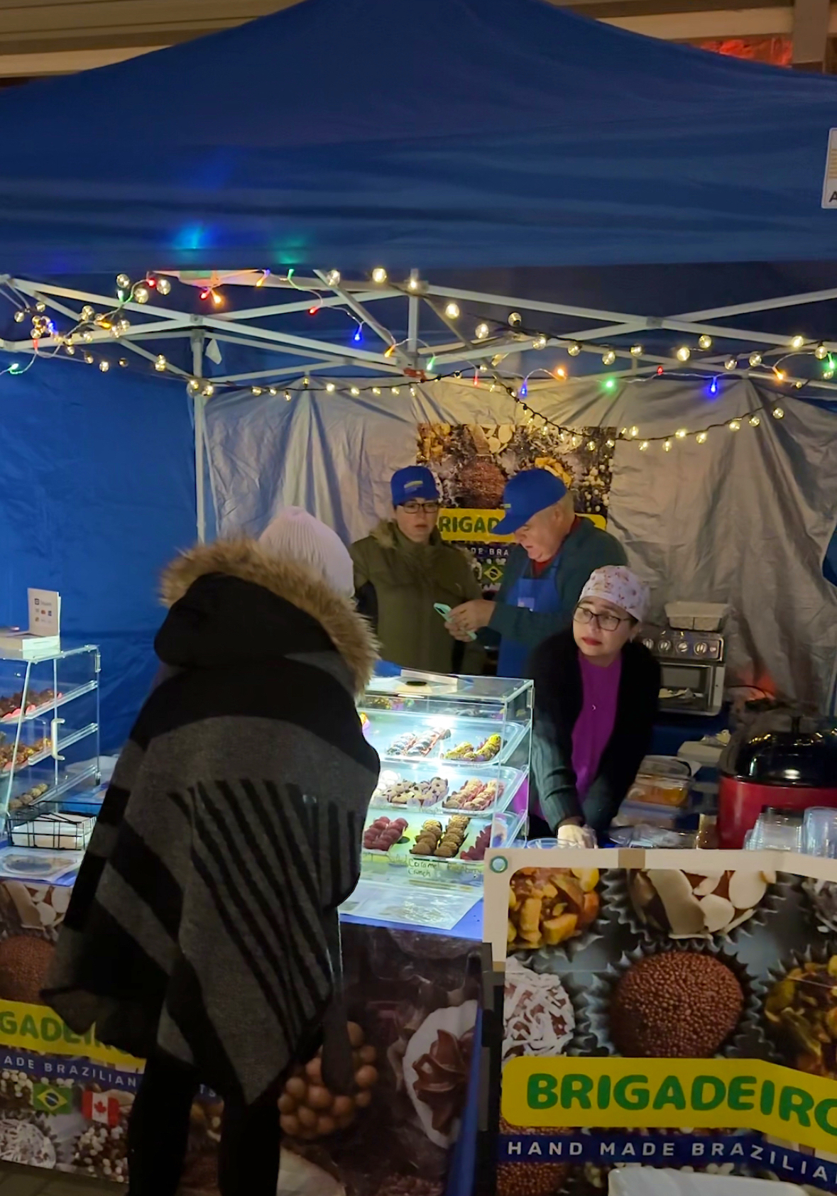 Vendor at holiday market. 