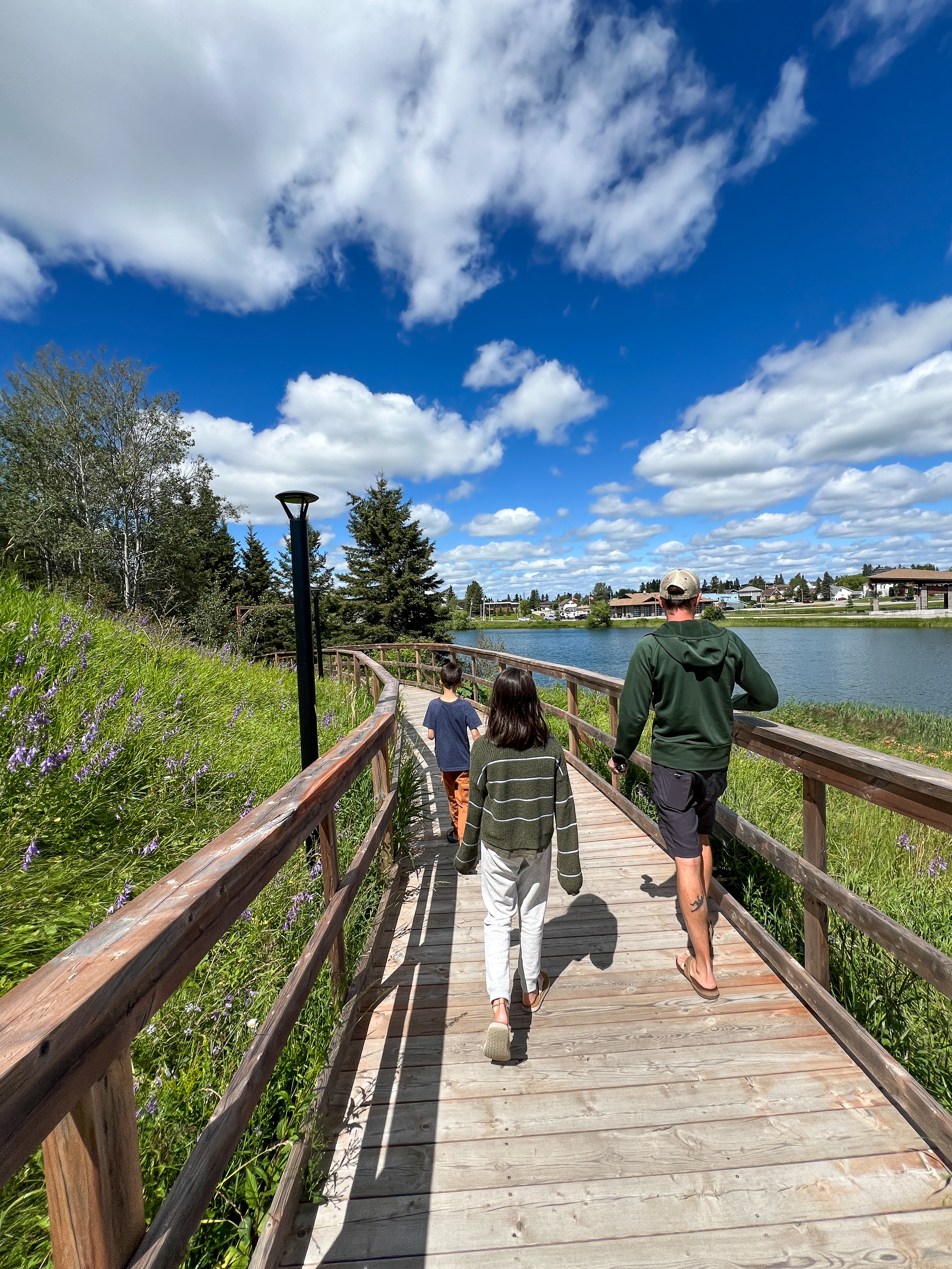 Young family walking around Lake Commando