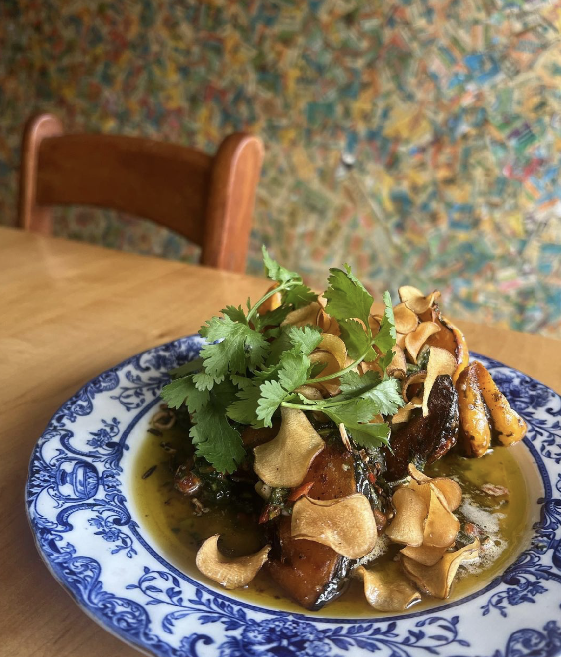 A delicious meat and potato dish topped with fresh cilantro and stacked on a blue and white china plate at Ernie's Coffee Shop in Sault Ste. Marie.