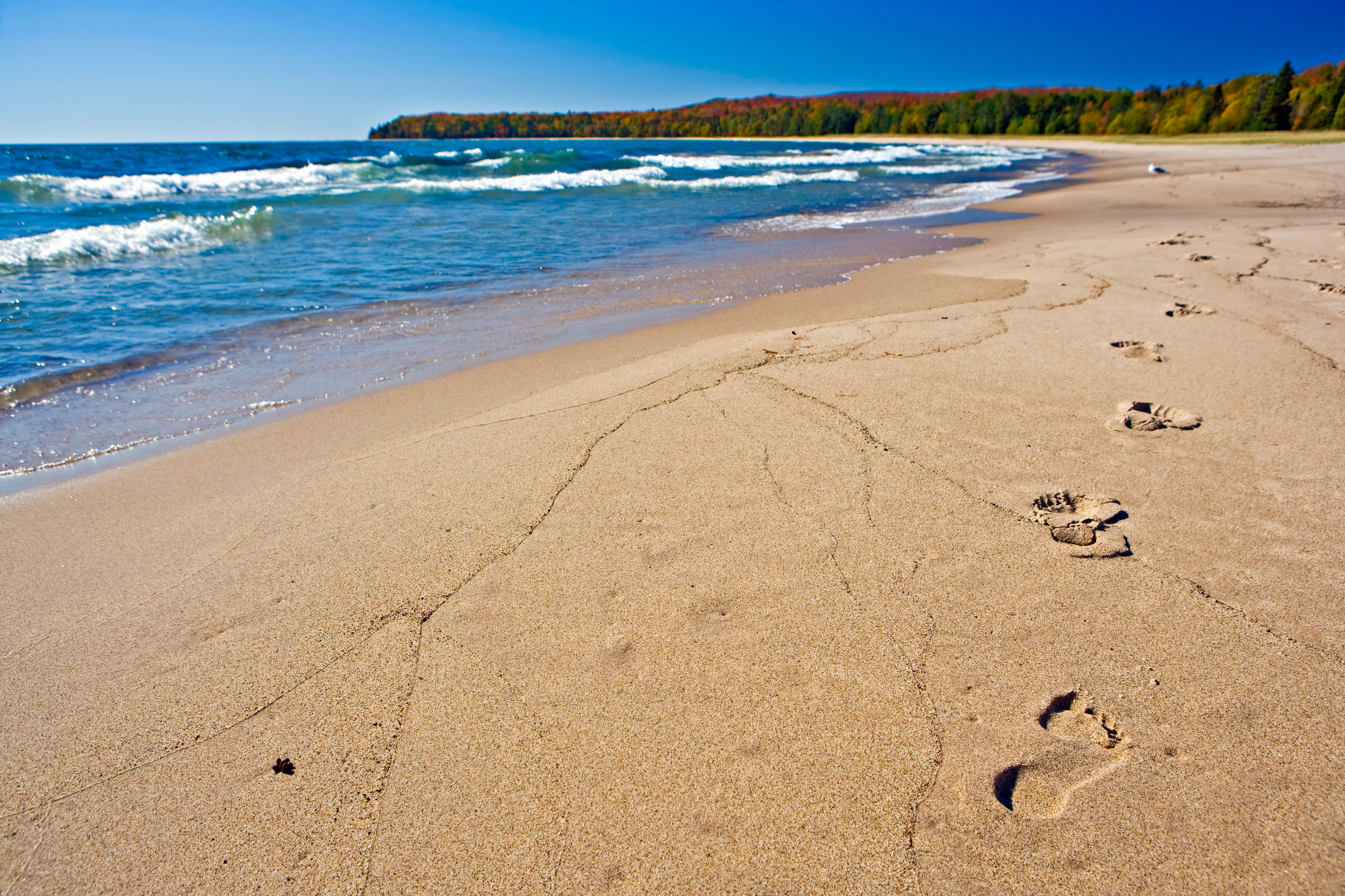 : Kilometres of soft sand beach curves around Lake Superior’s aquamarine waters at Pancake Bay Provincial Park.  Credit: HP Canada