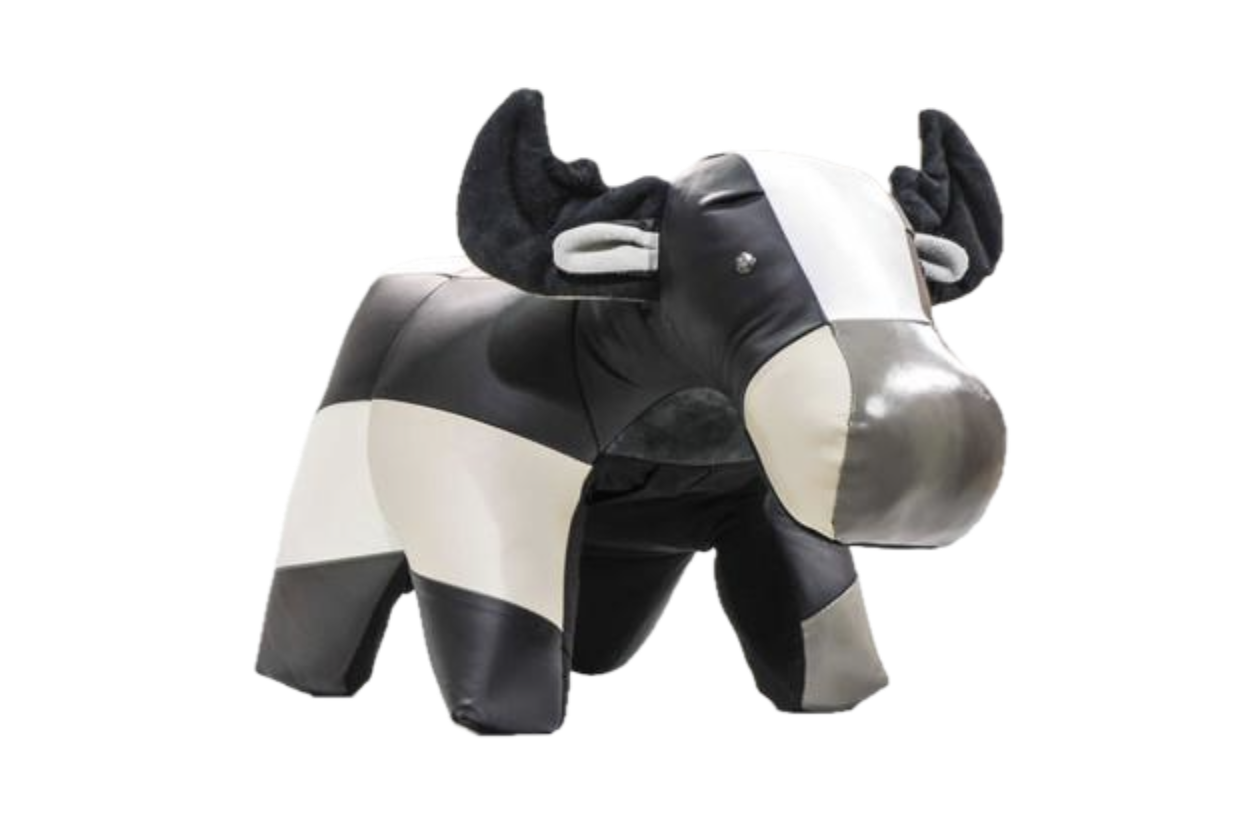 a black and white leather ottoman shaped like a stuffed moose