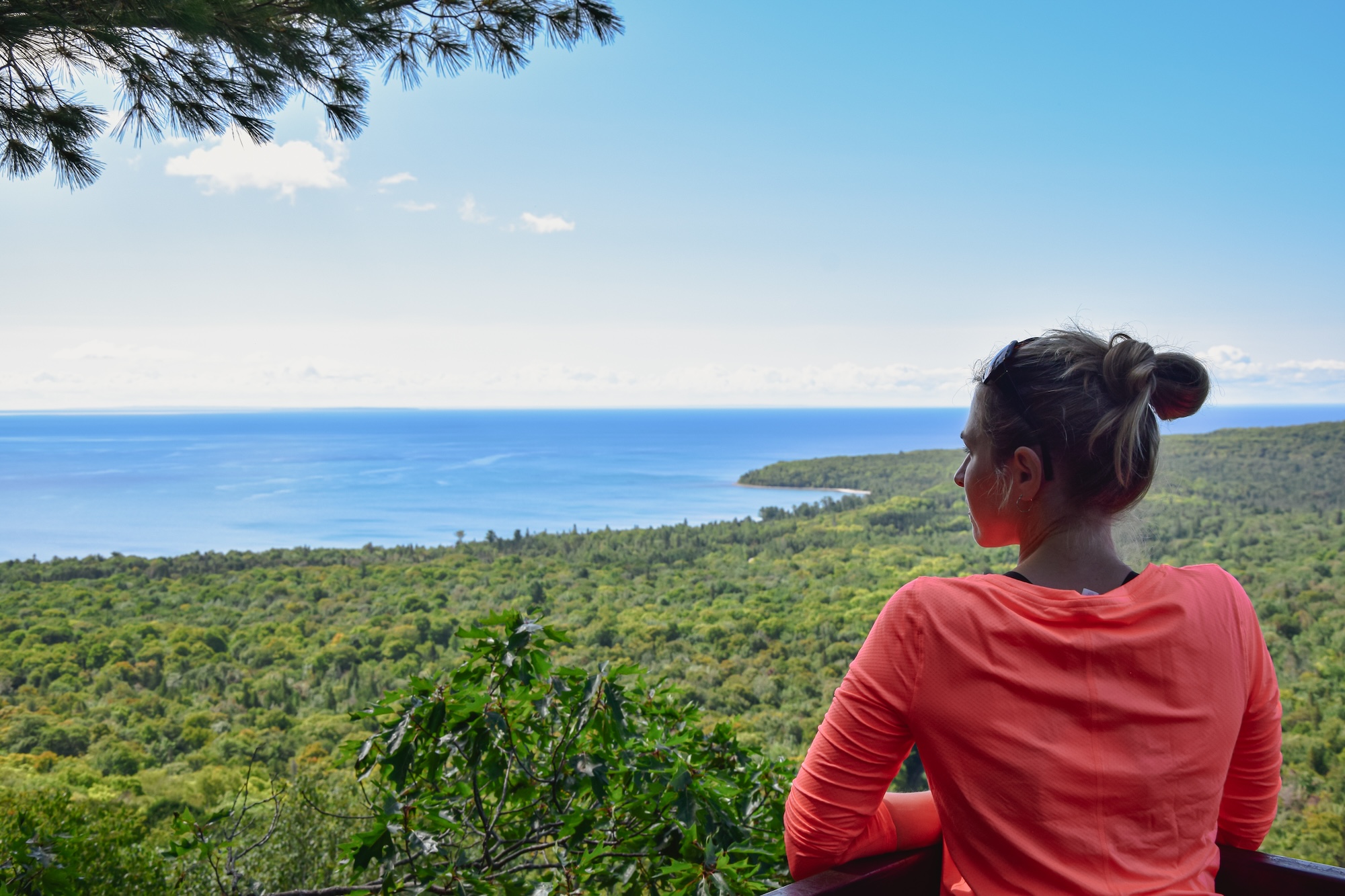 A woman looks out over Lake Superior. 