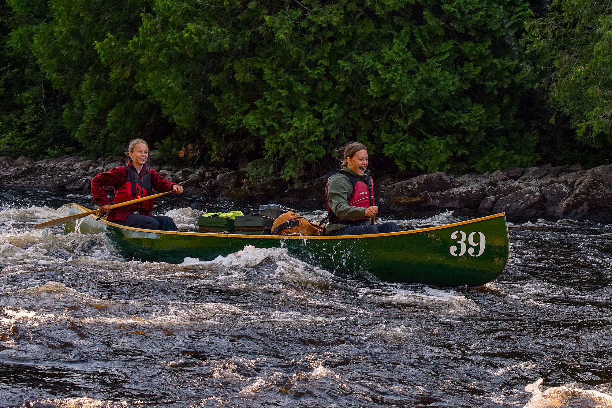 Canoeing whitewater with Camp Keewaydin. Credit: Camp Keewaydin