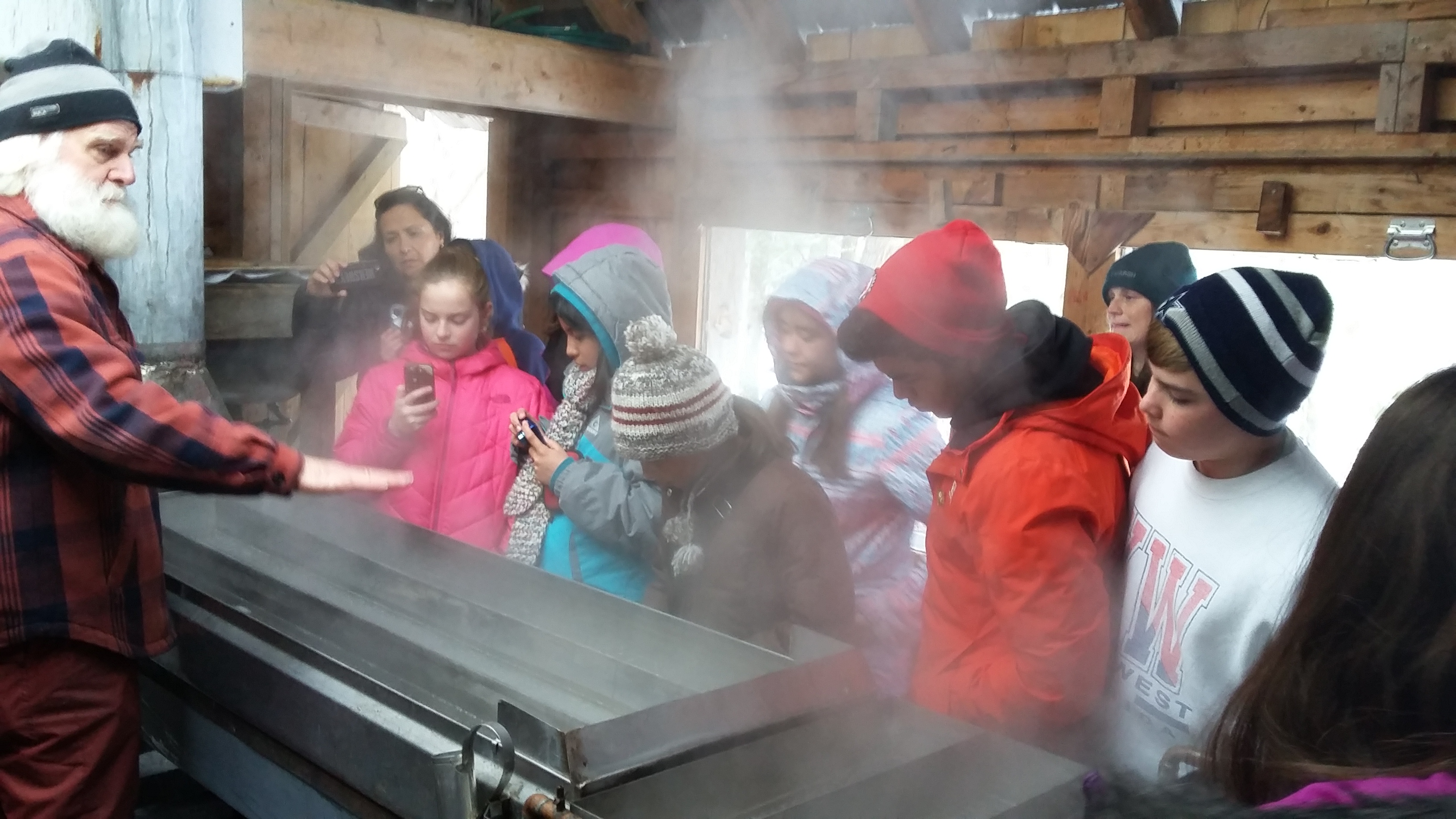 Gather around the evaporator to learn more about the process of making maple syrup.  Credit: Friends of Wye Marsh