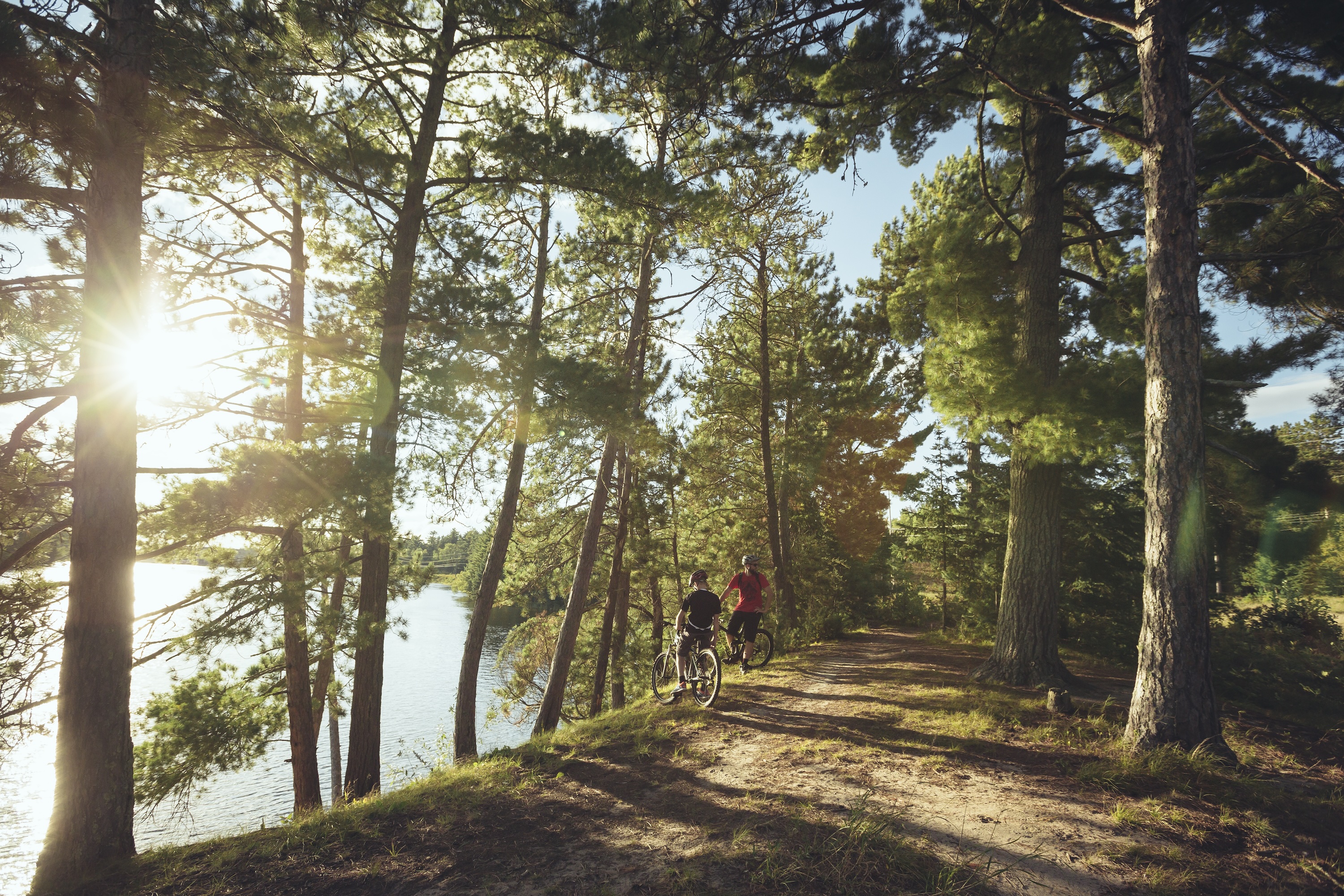 Biking wooded trails near Kenora, Ontario. Credit: Destination Ontario