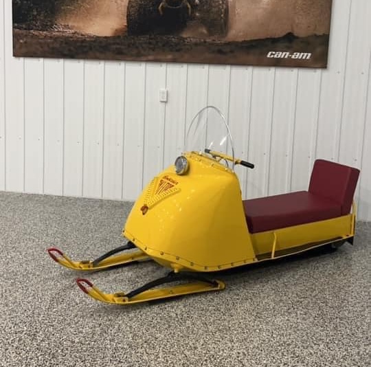 A vintage 1965 Ski-doo Olympique on display indoors.