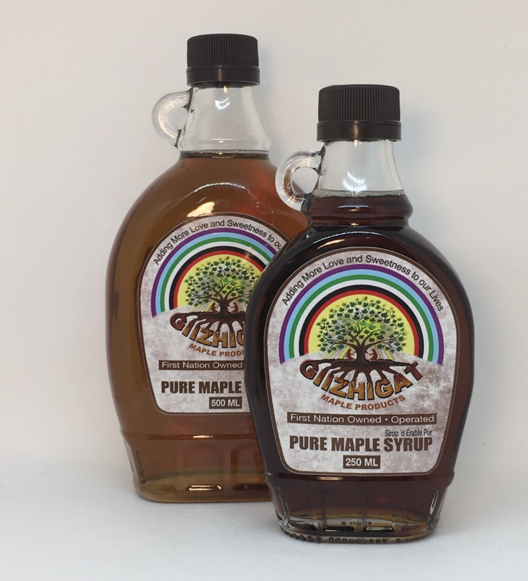 Two bottles of maple syrup.