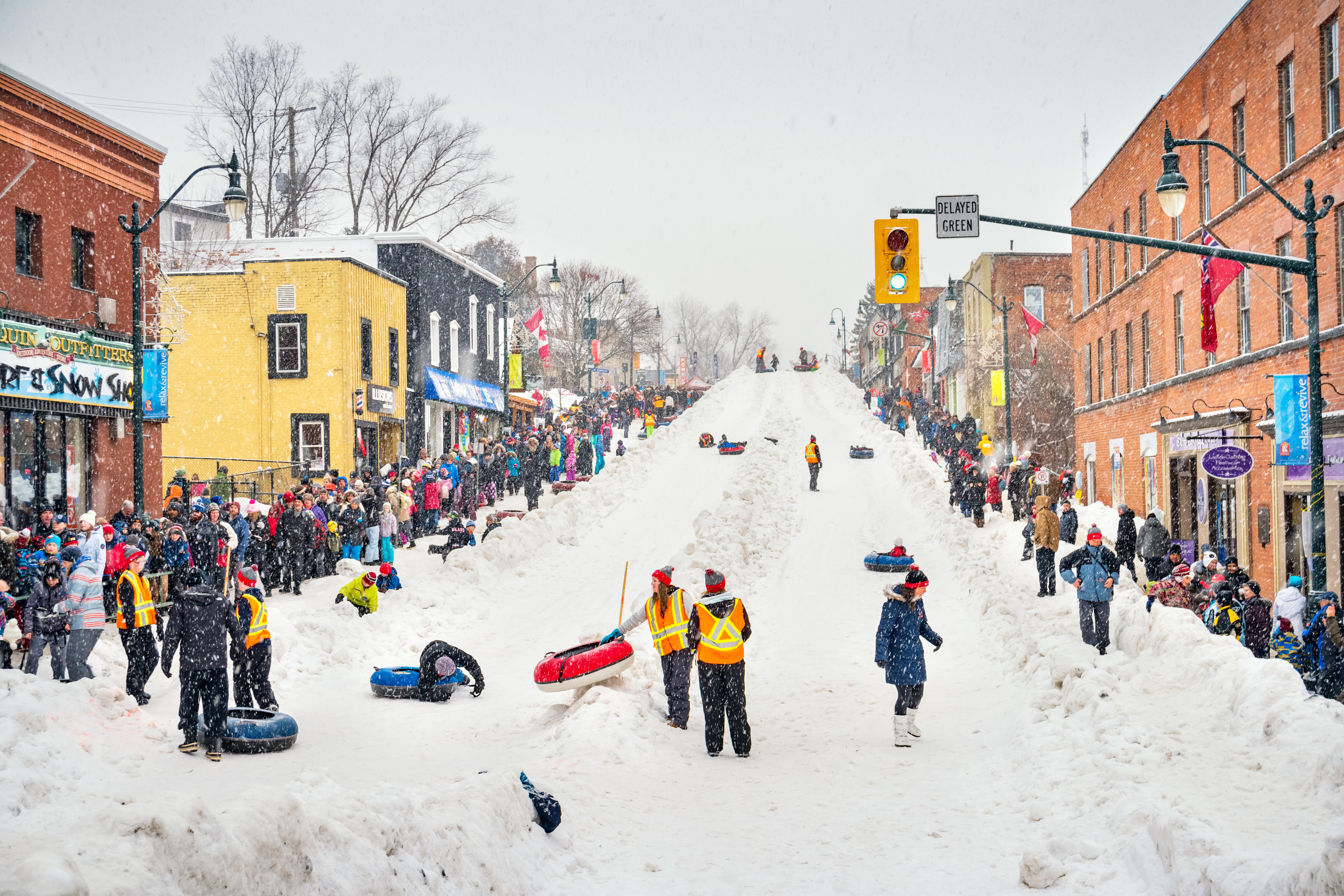 Bracebridge street turns into a giant toboggan run during the Fire And Ice Festival.  Credit: Alamy.com