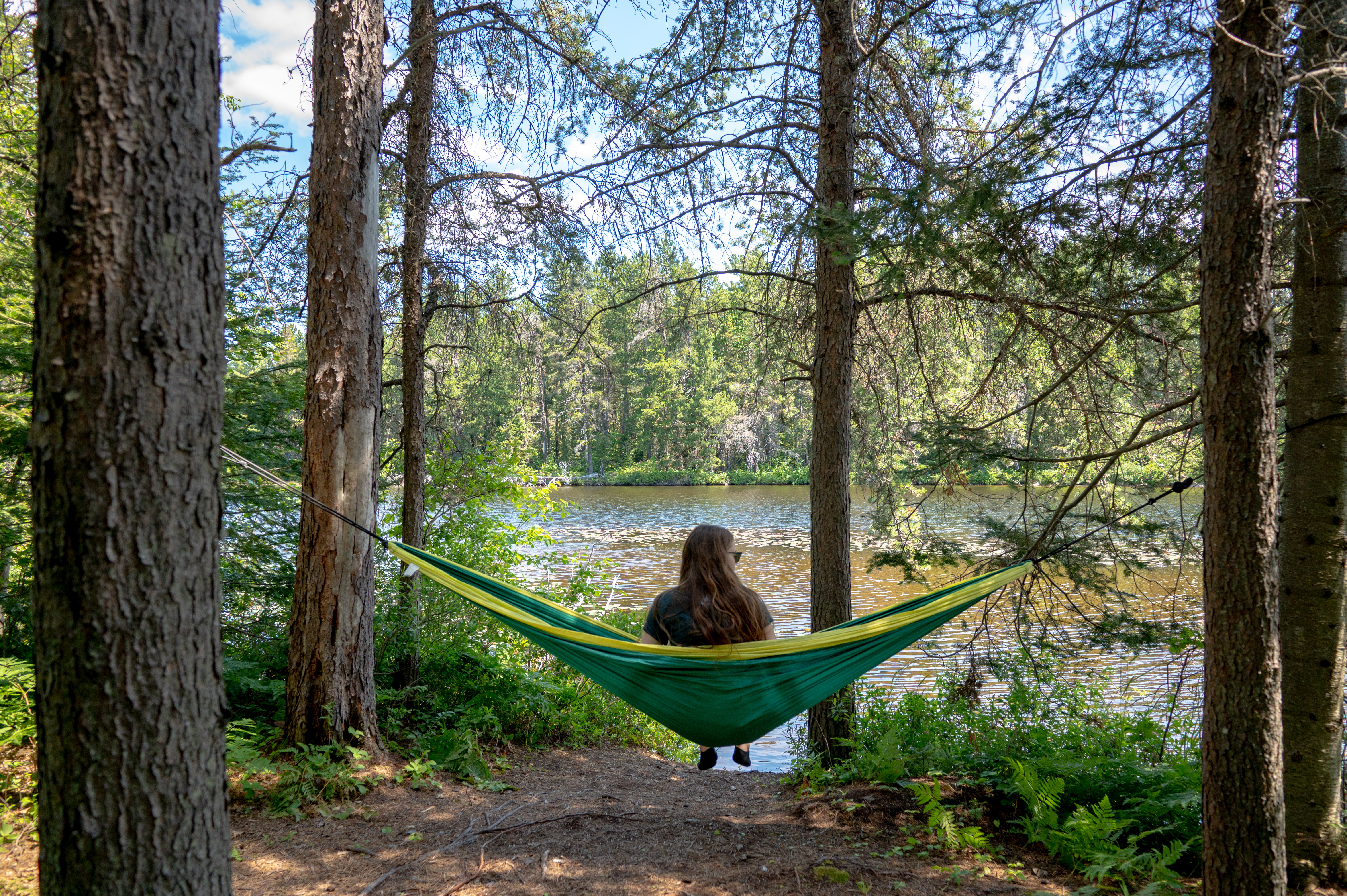 Hammocking near the water at Windy Lake Provincial Park. • Photo: Ontario Parks